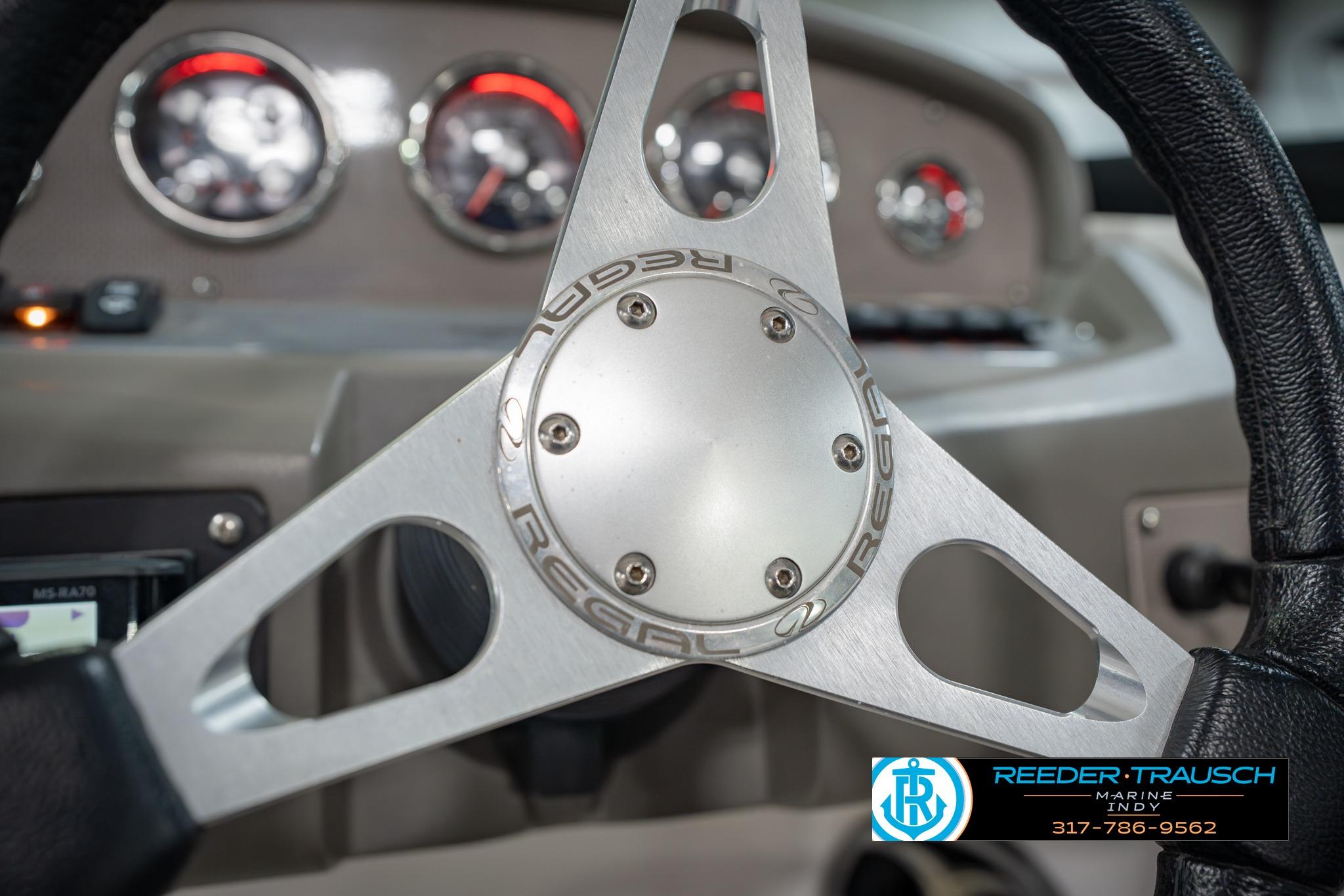 Steering wheel of 2015 Regal 2000 ESX Bowrider with dashboard gauges.