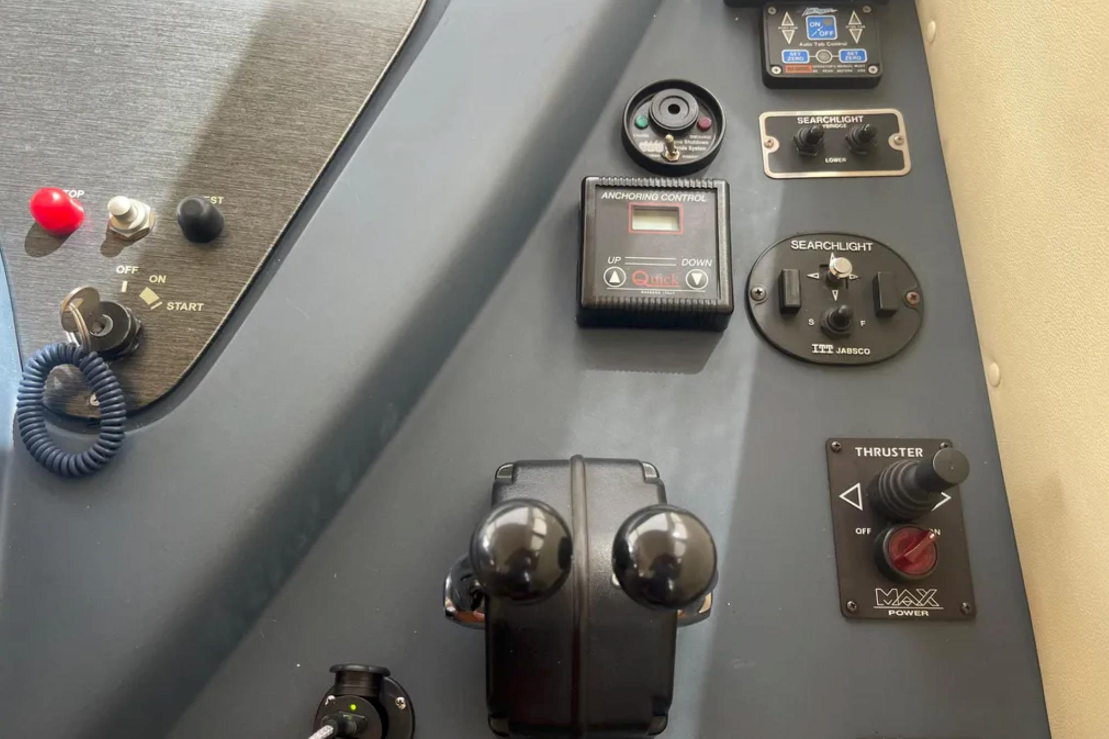 Control panel of a 2004 Azimut 46 yacht with various switches and dials.