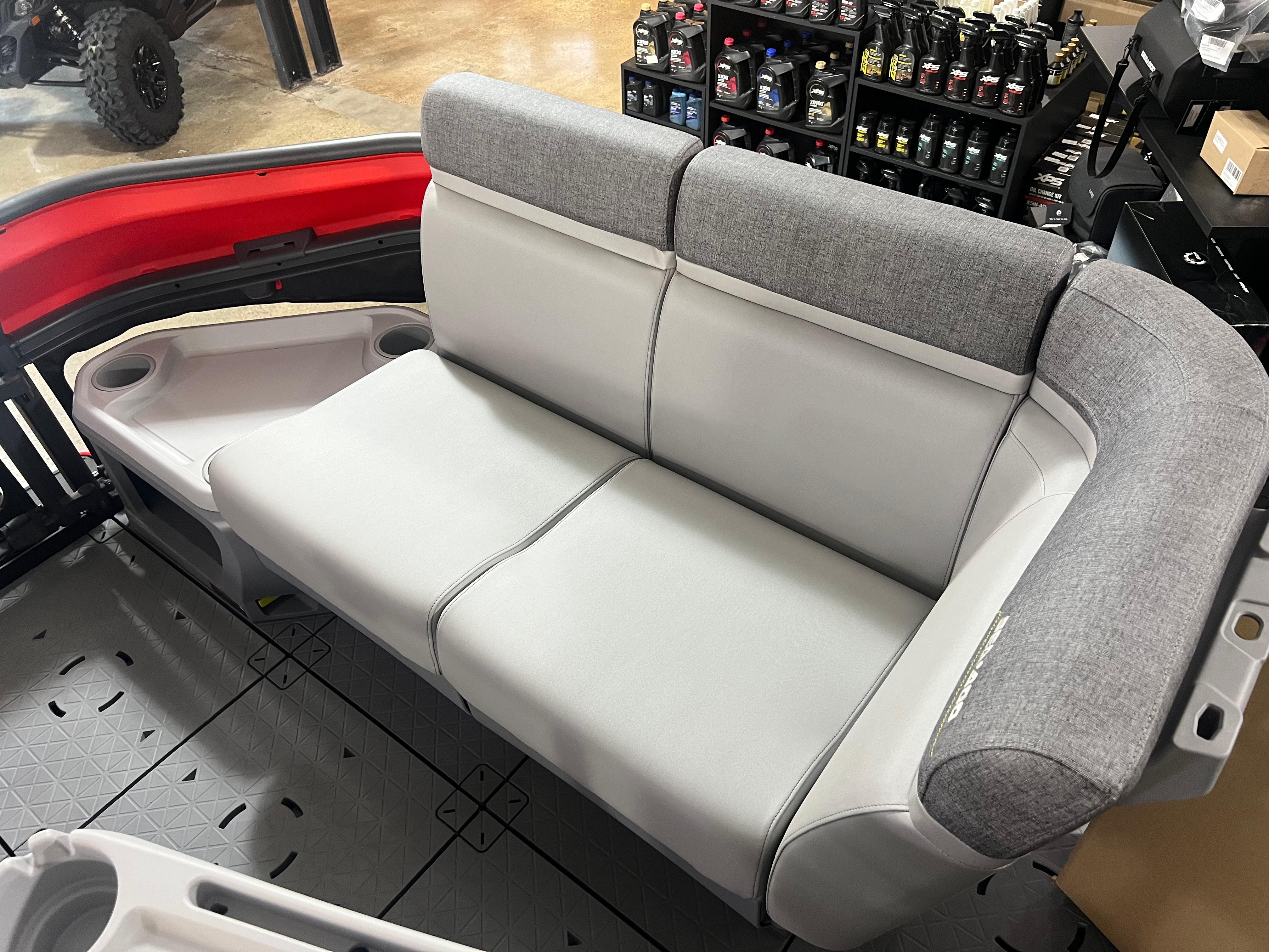 2025 Sea-Doo Switch Cruise 21 interior seating with gray upholstery and cup holders.