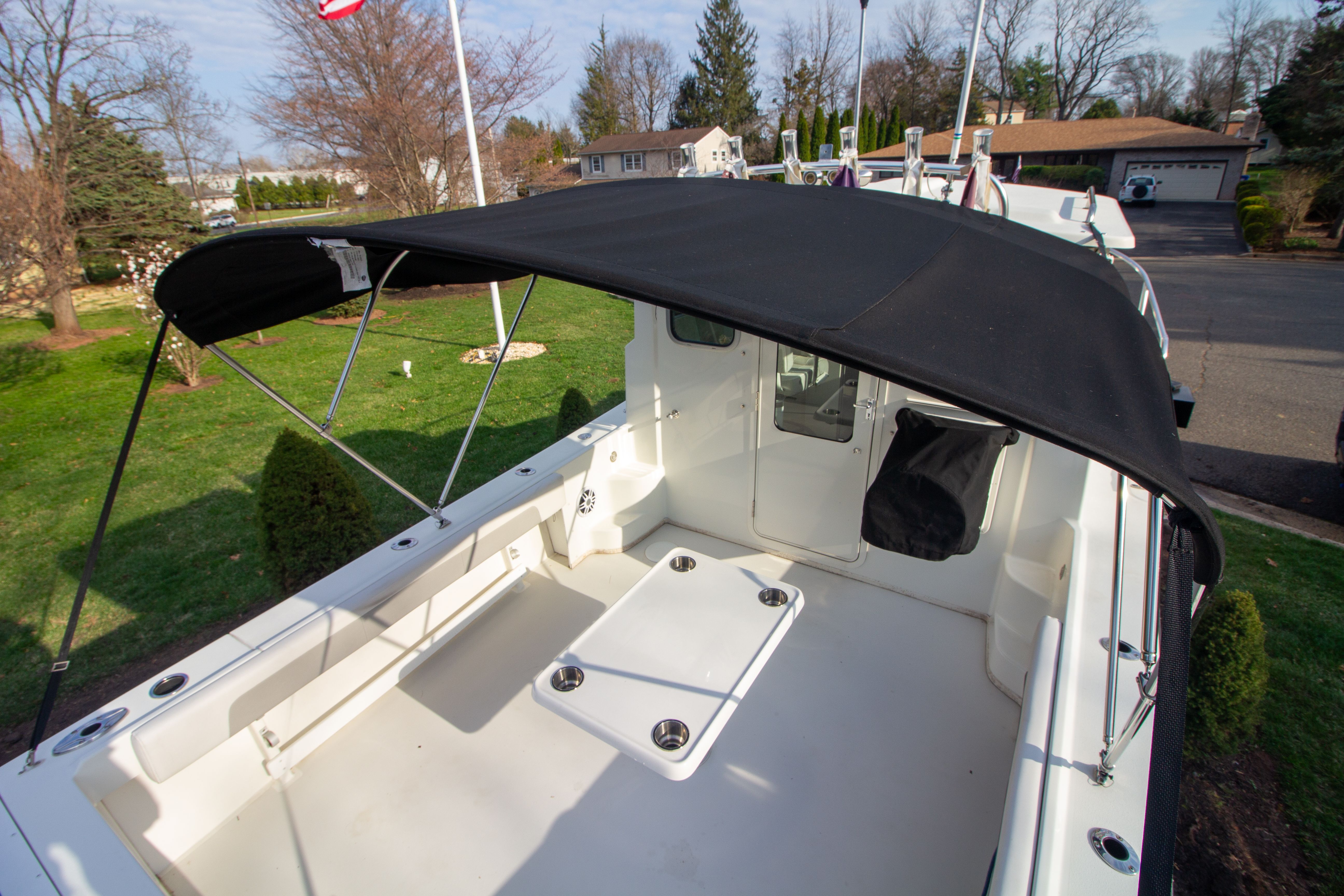 2022 Parker 2520 XLD Sport Cabin with black sunshade outdoors.