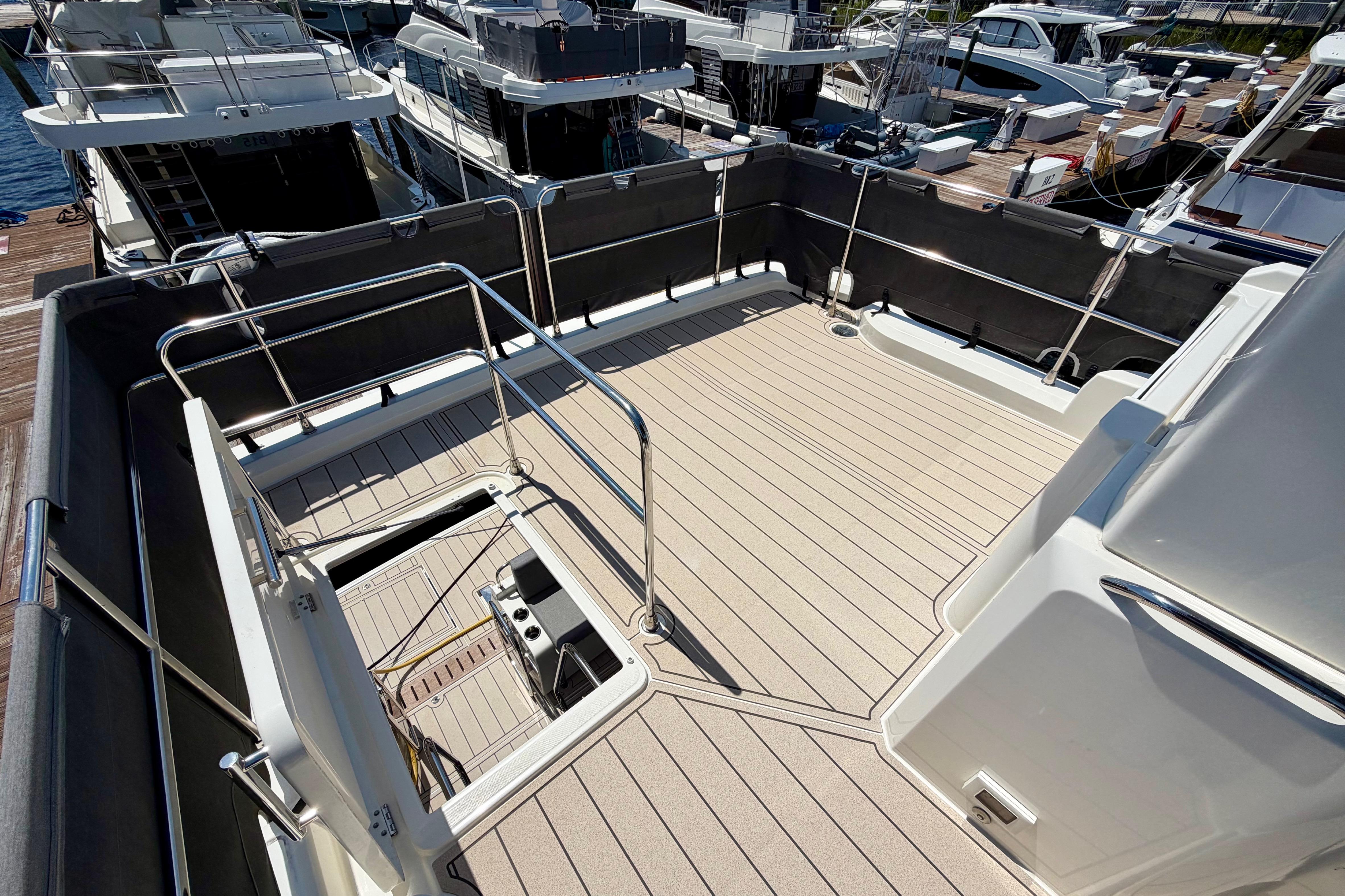 Flybridge of 2025 Beneteau Swift Trawler 41 Fly, featuring spacious deck and railing.