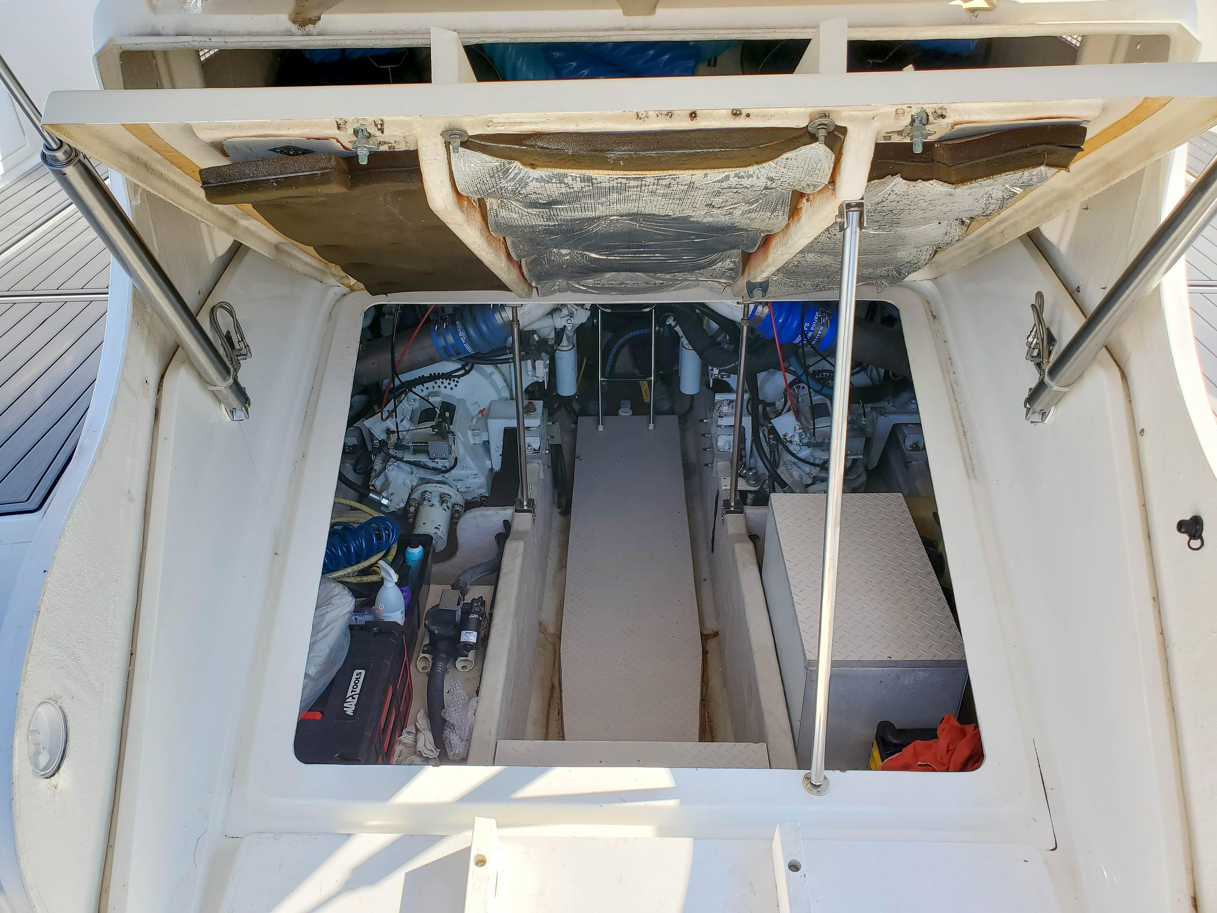 Engine compartment of a 1997 Sea Ray 580 Super Sun Sport boat, showing mechanical components.