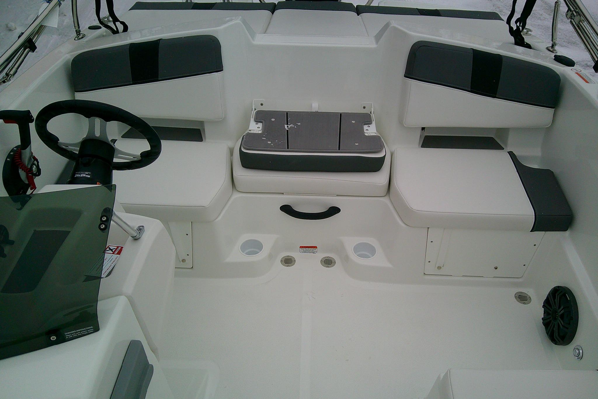 2026 Tahoe T18 boat interior with seating and steering wheel.