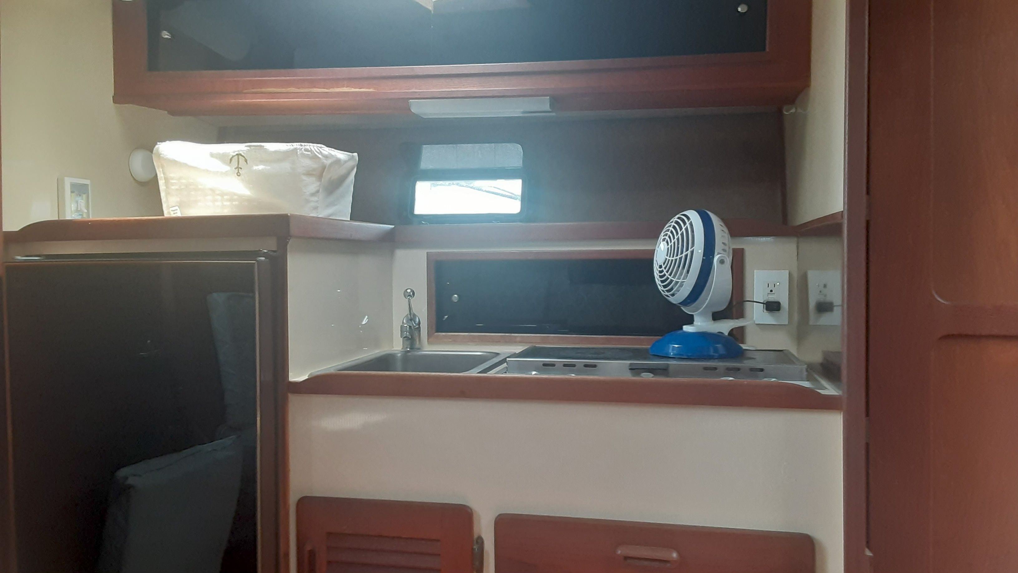 Interior of 1985 Tiara Yachts 3100 Open with kitchenette.
