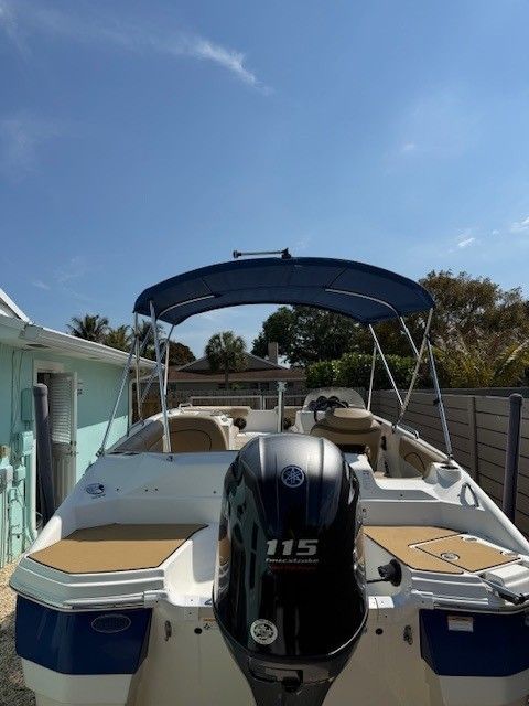 2020 Nautic 203SC boat with Yamaha 115 engine, blue sunshade.