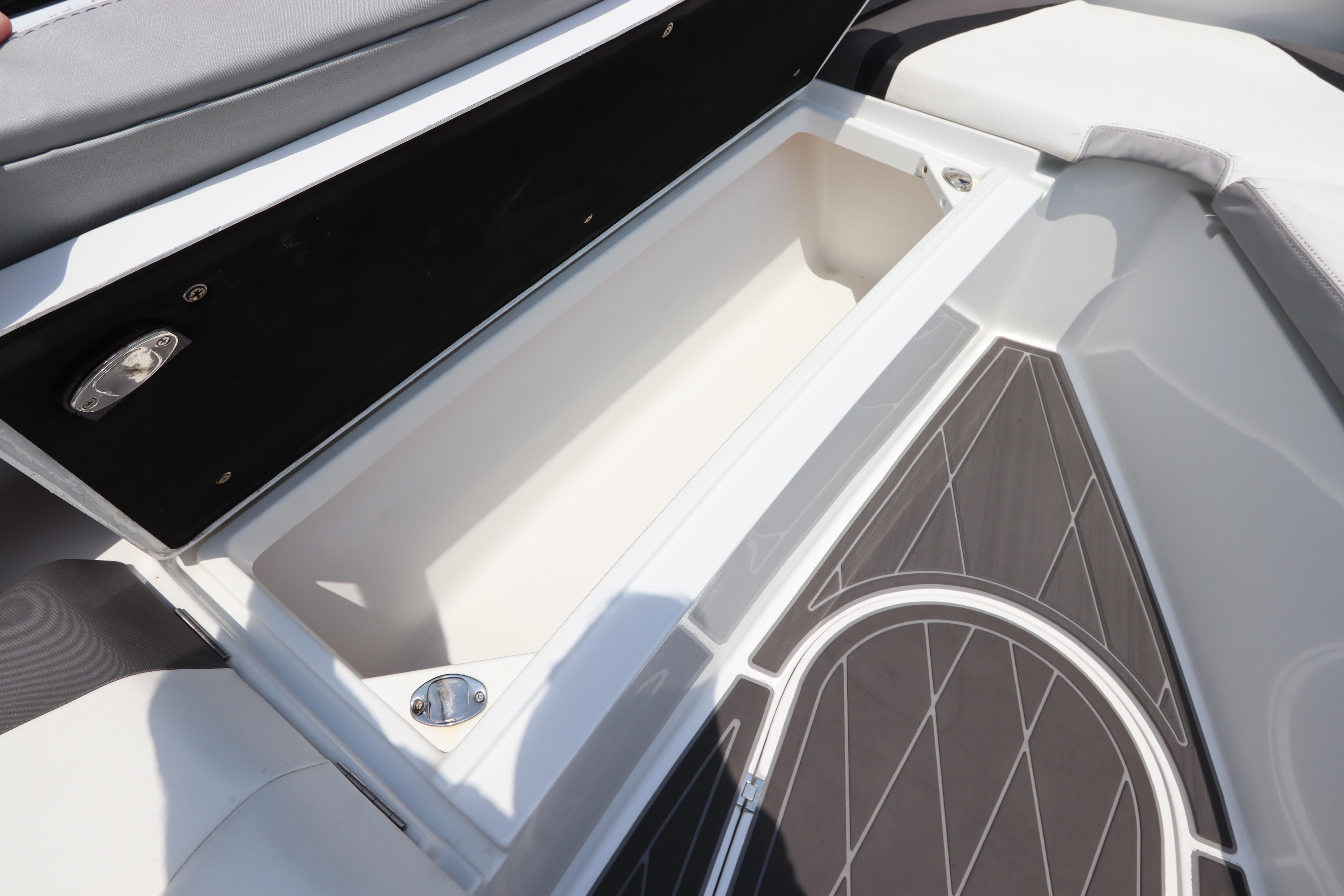 2019 Statement 350 Open boat storage compartment with cushioned seating and non-slip flooring.