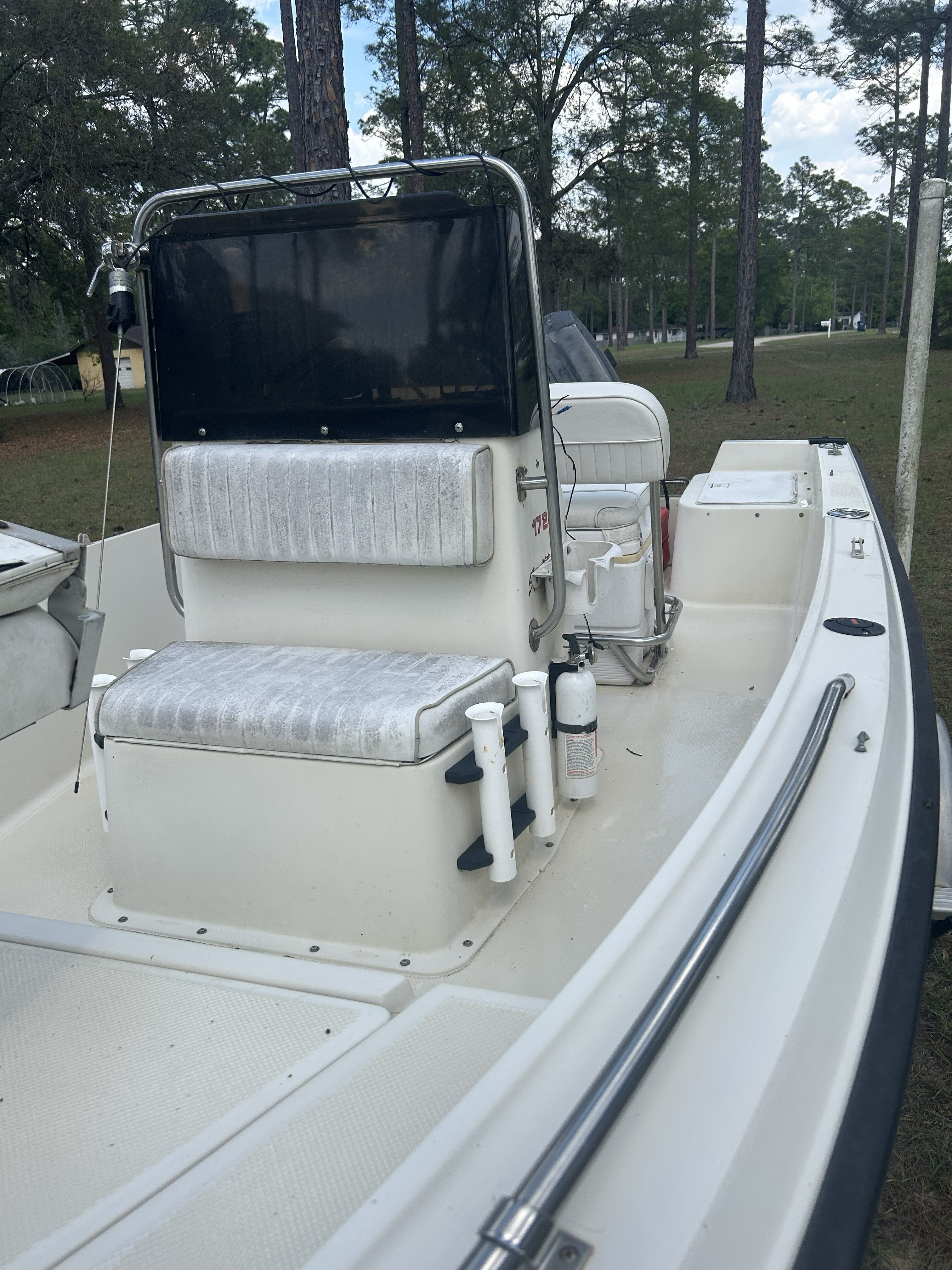 1993 Key West 1720 boat with seating and console.