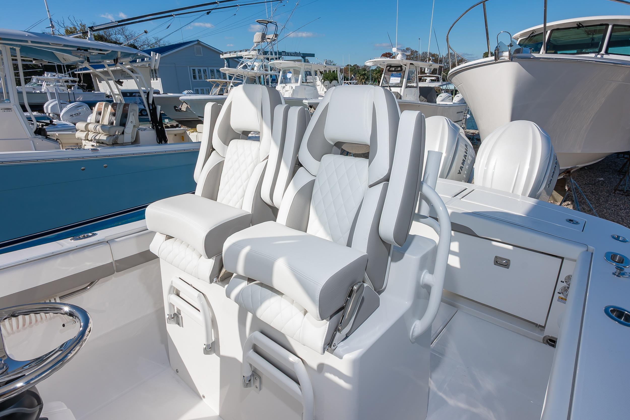2026 Regulator 28 boat with luxurious seating and modern design in a marina setting.