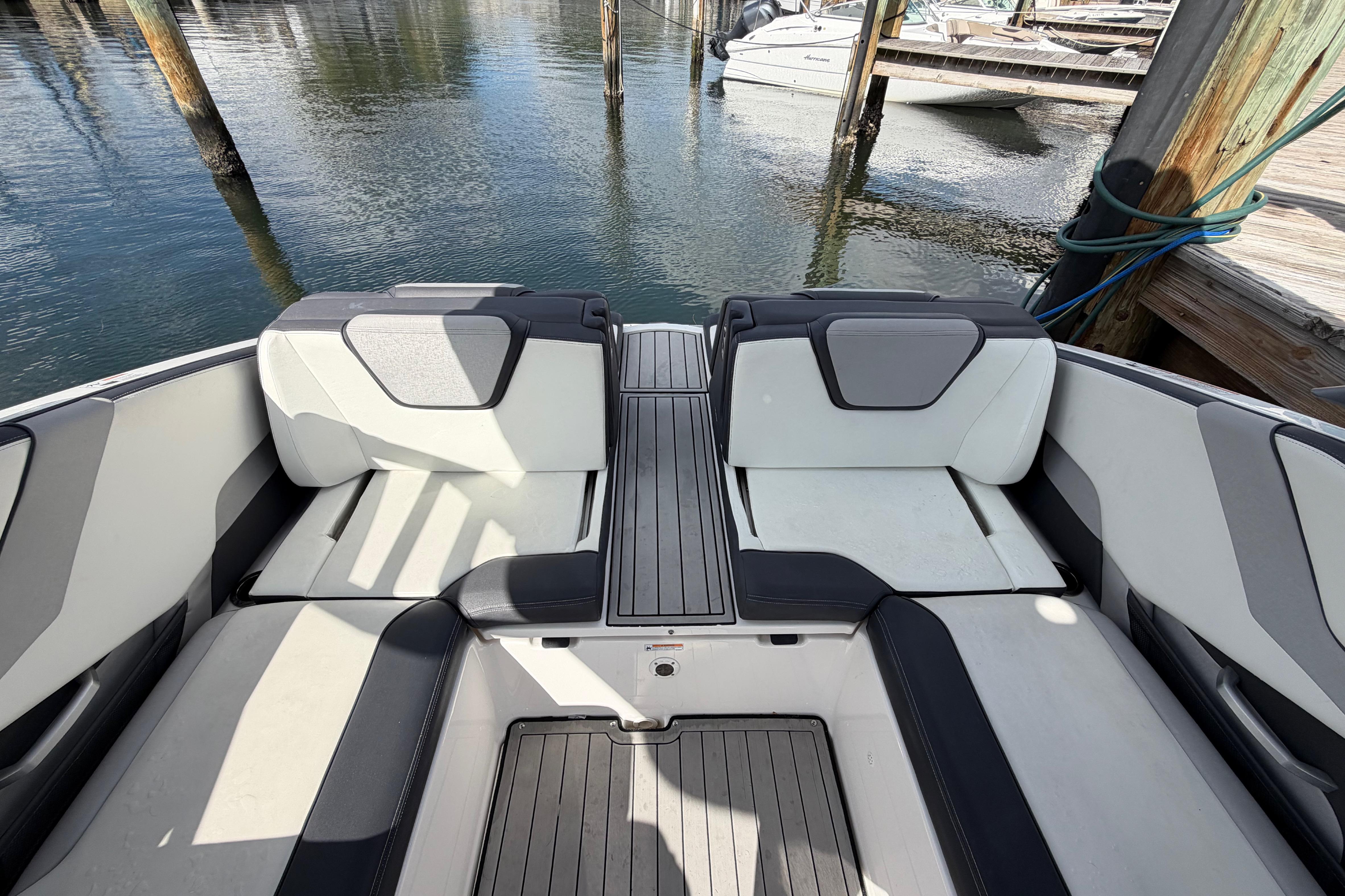 2022 Yamaha Boats 252SD interior seating area at a dock.