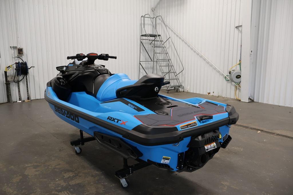 2026 Sea-Doo RXT-X 325 jet ski in a garage, showcasing sleek blue design.