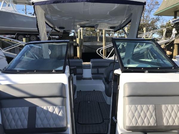 2020 Rinker 29QX BR boat interior with gray seating and open cockpit.