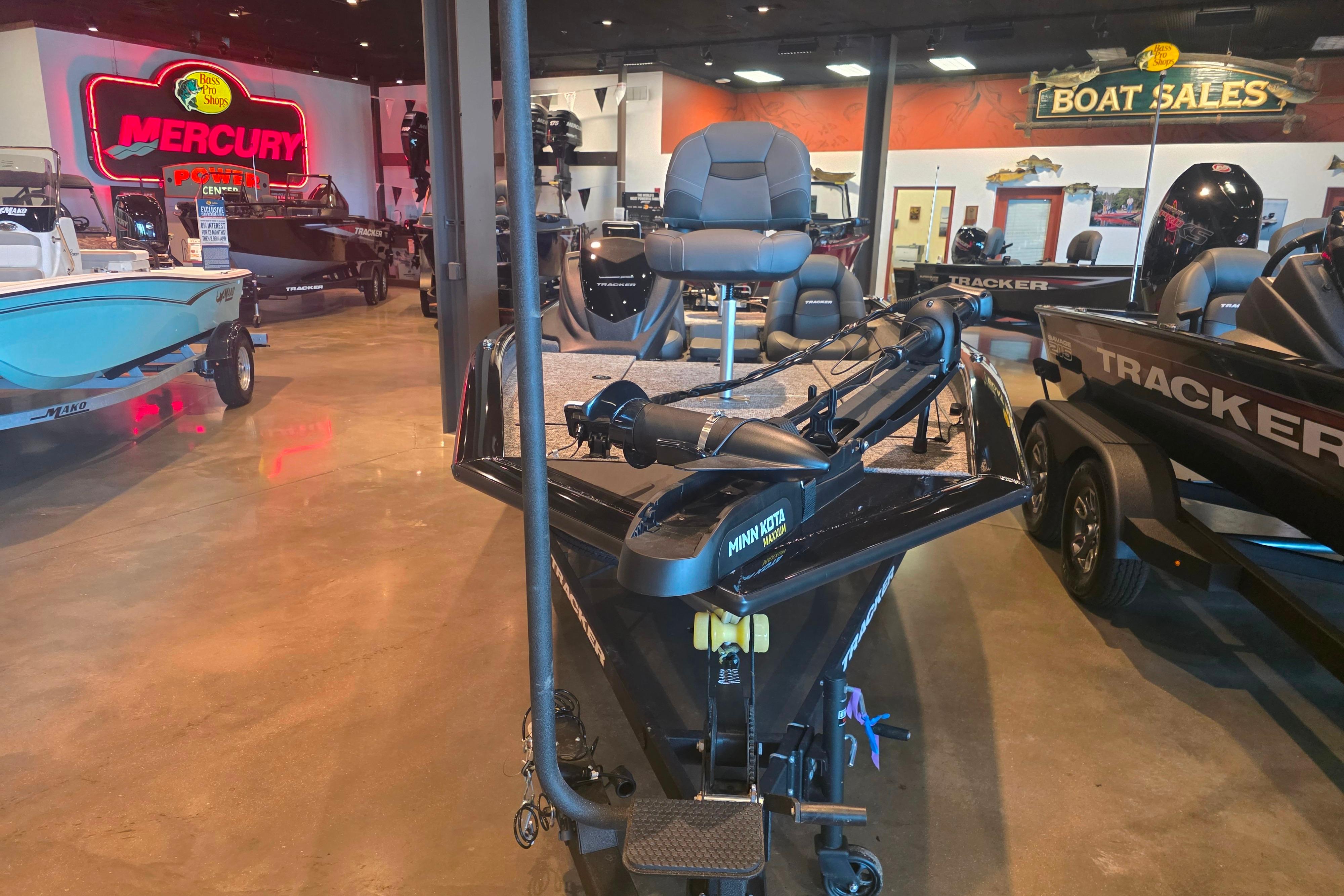 2026 Tracker Pro Team 190 boat displayed in showroom with Mercury signage.