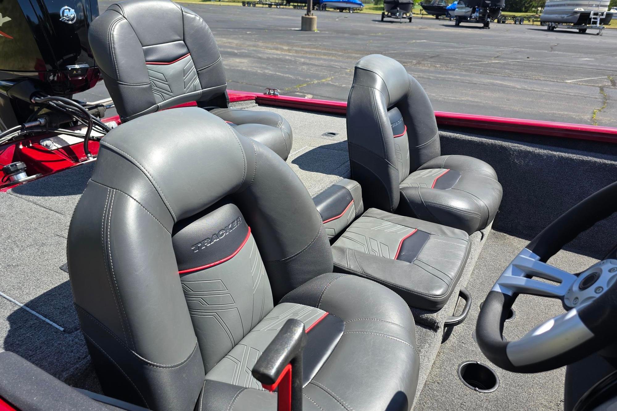 2021 Tracker Pro Team 175 TXW boat interior with gray leather seats and steering wheel.