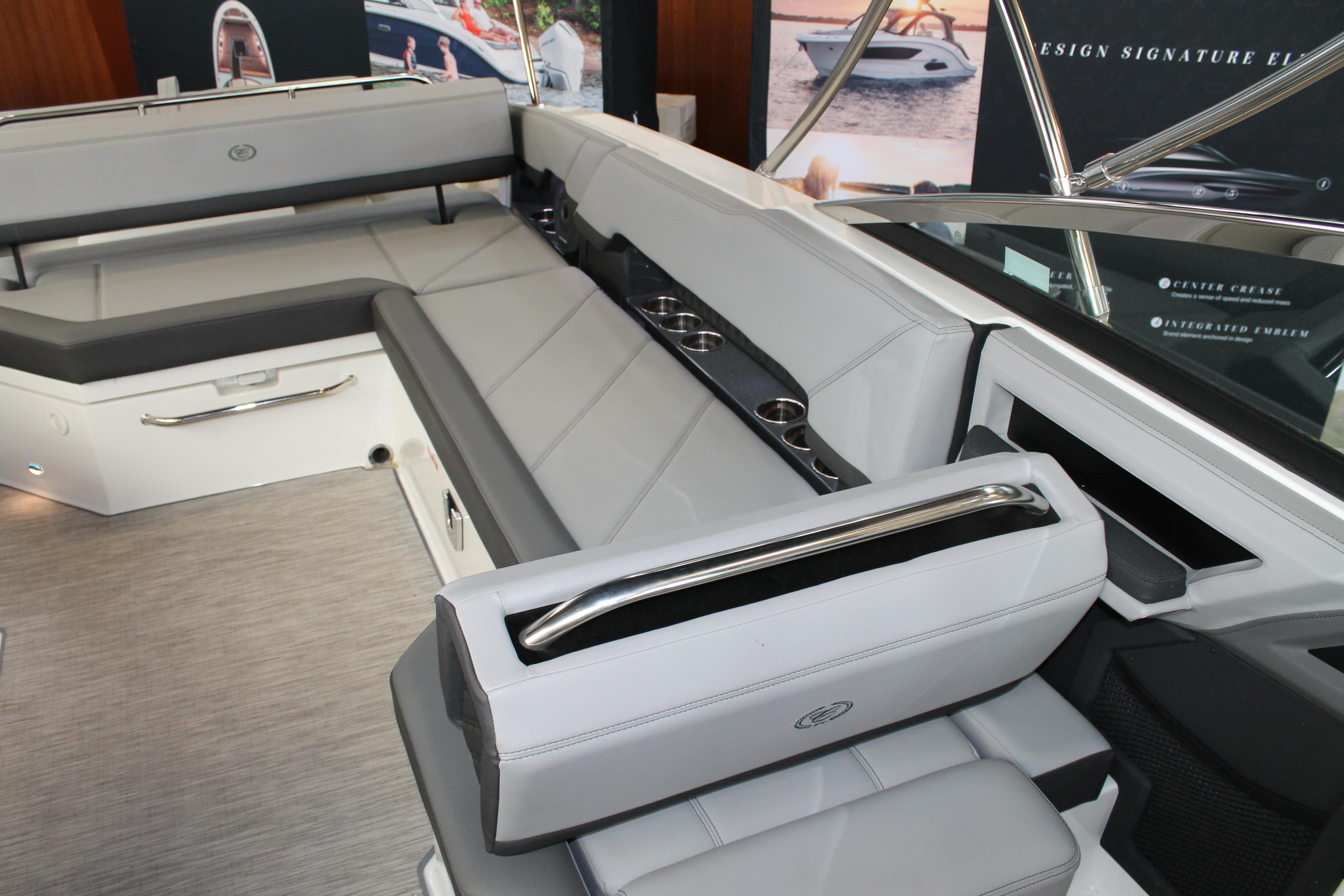 Luxurious interior of 2023 Cobalt R8 boat with sleek seating and cup holders.