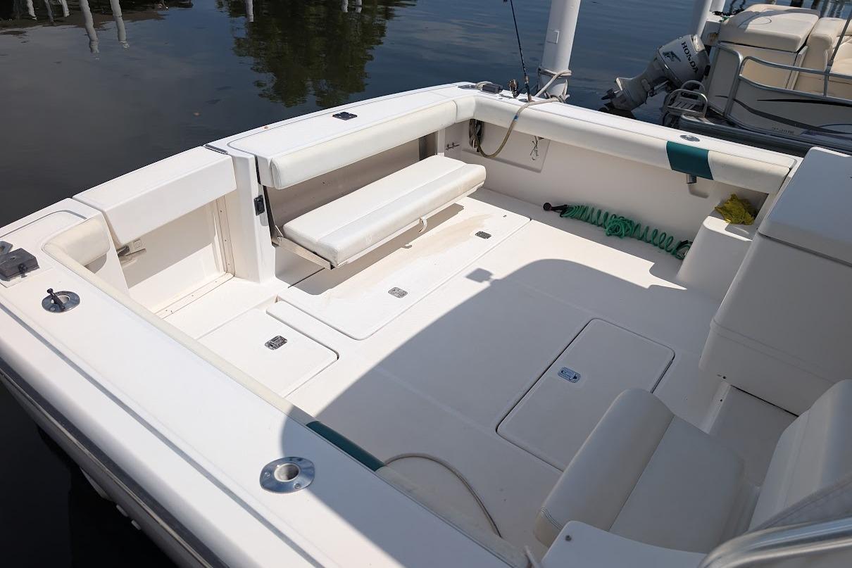 2000 Pursuit 3400 Express boat deck with seating and storage compartments.