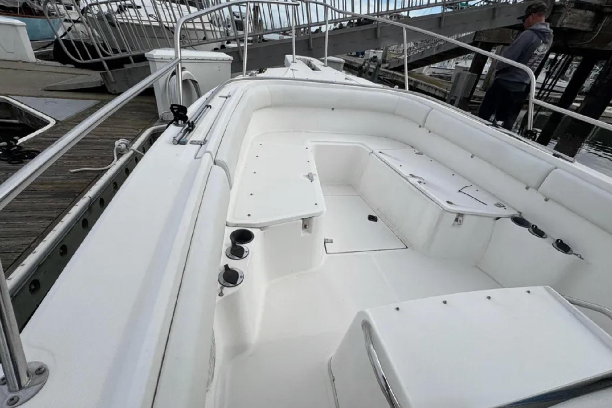 2001 Boston Whaler 26 Outrage boat interior with seating and storage compartments.