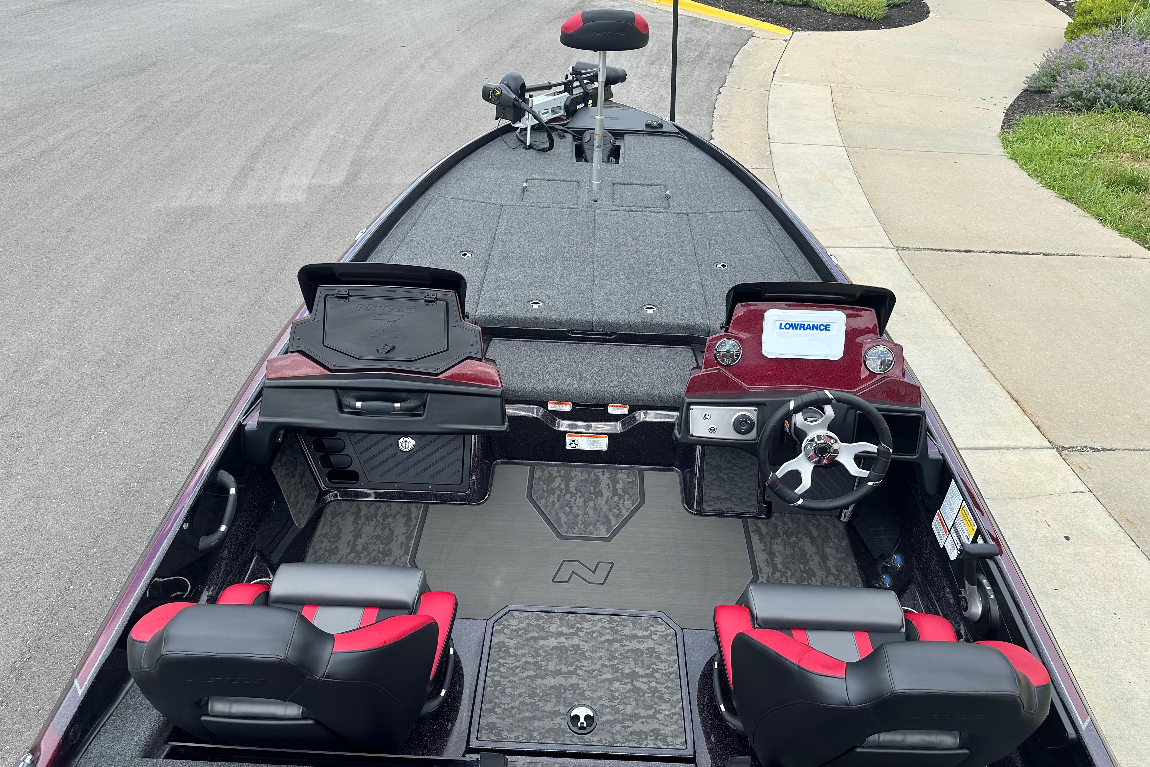 2026 Nitro Z21 XL boat interior with steering wheel, seats, and Lowrance electronics.