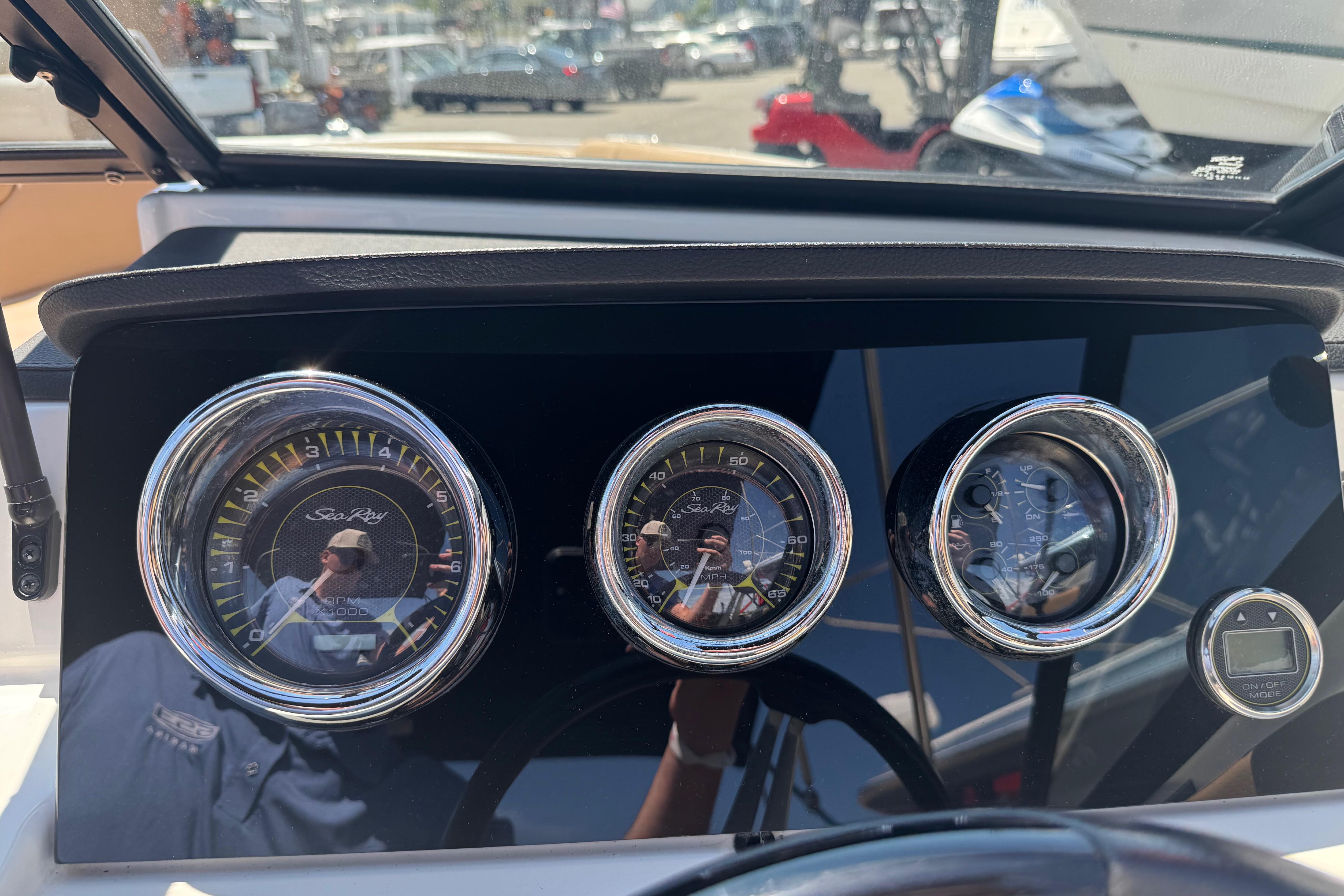 Dashboard of a 2021 Sea Ray SPX 190 boat with chrome-rimmed gauges.