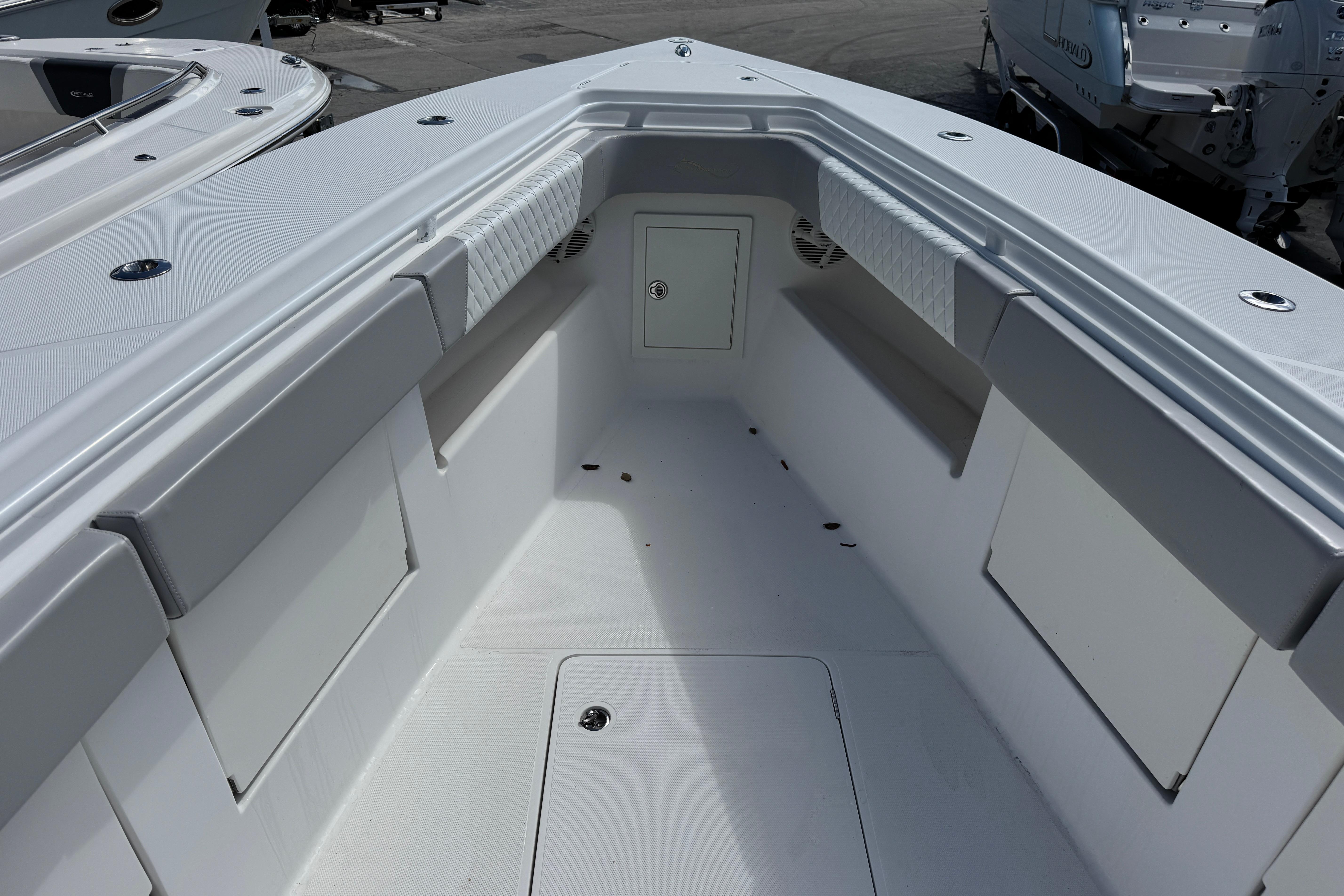 2014 Blackwater 36 Sportfish boat interior with cushioned seating and storage compartments.