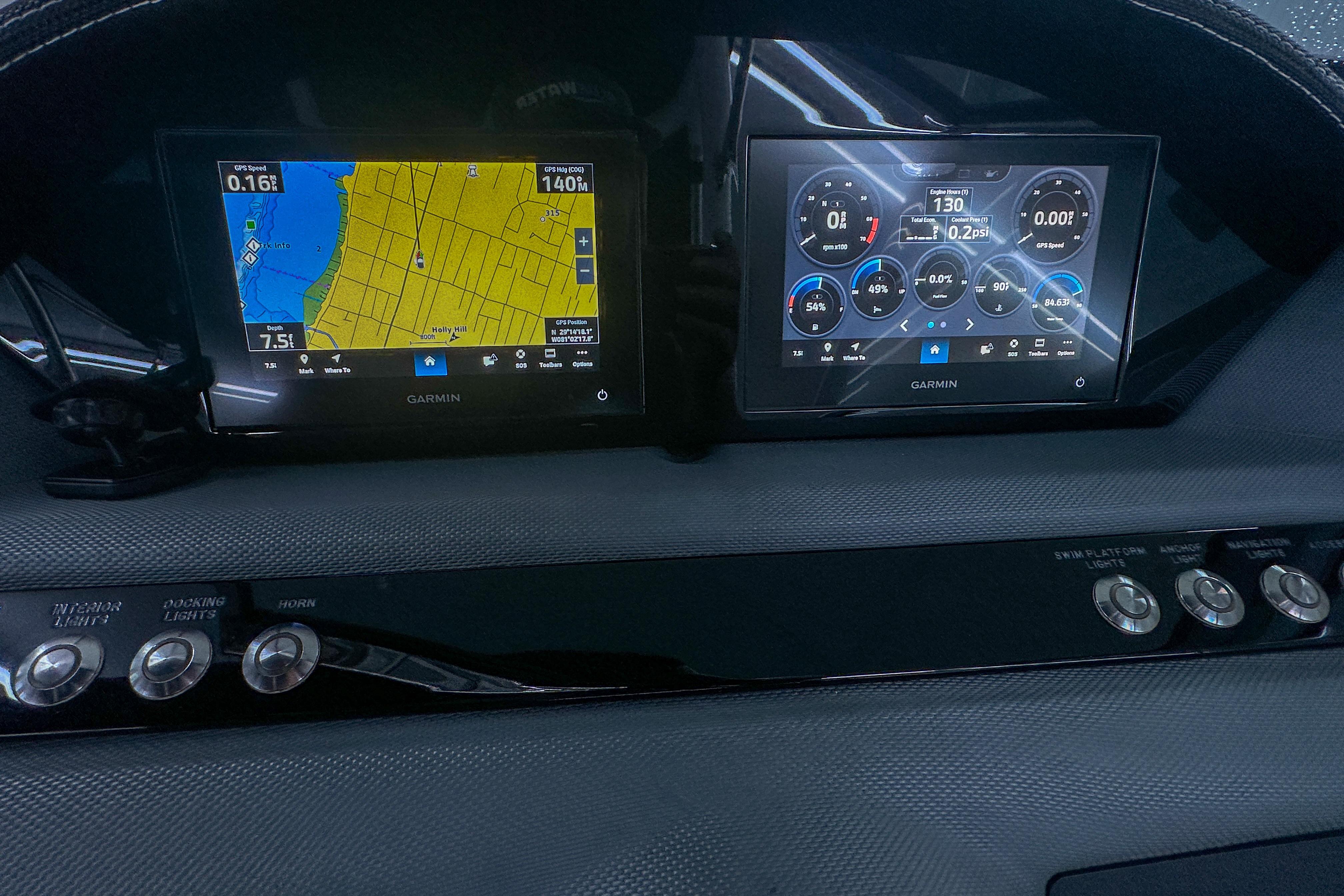 Dashboard of 2022 Cobalt 25SC with Garmin navigation and control displays.