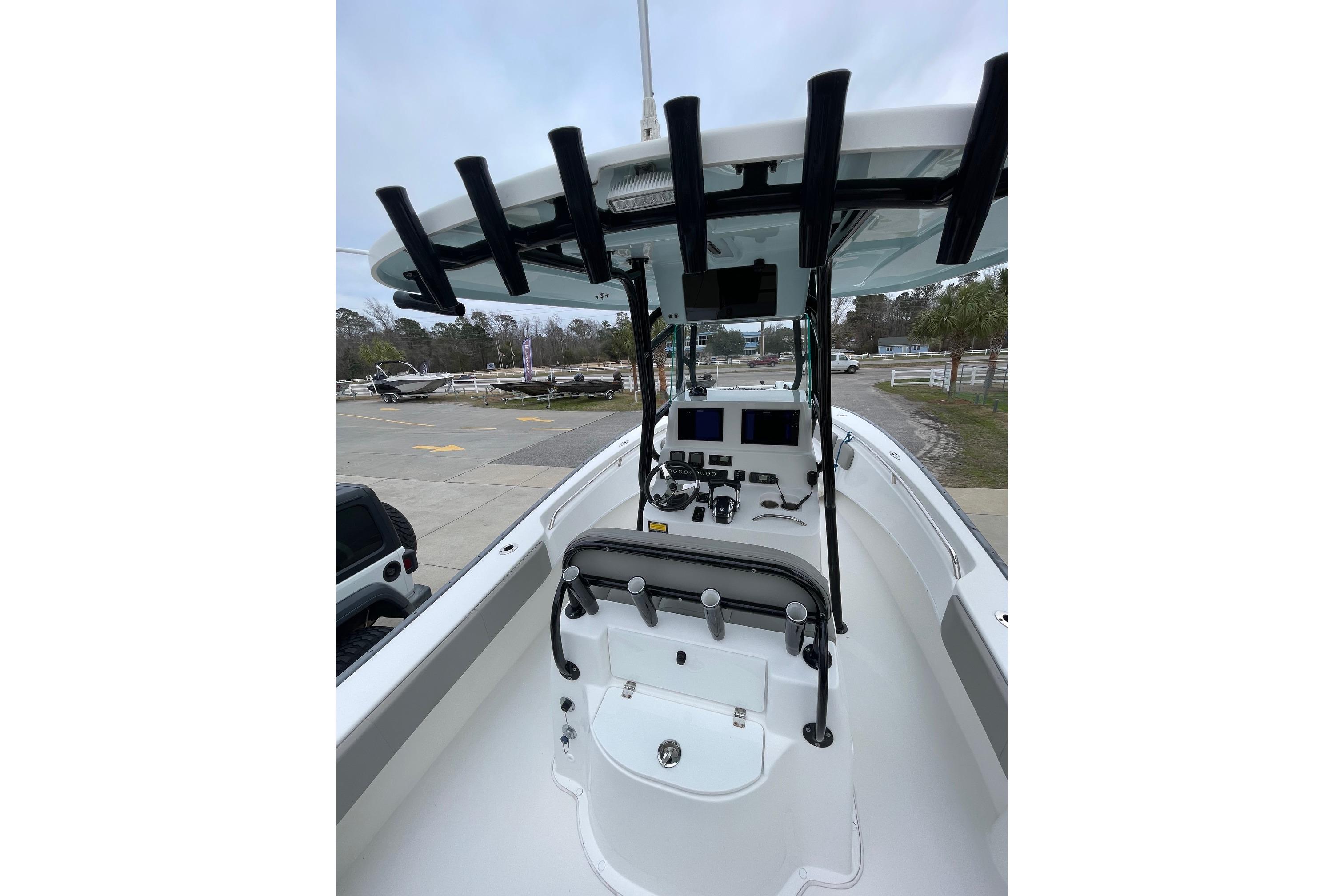 2023 Cape Horn 24 XS boat interior with modern dashboard and rod holders.
