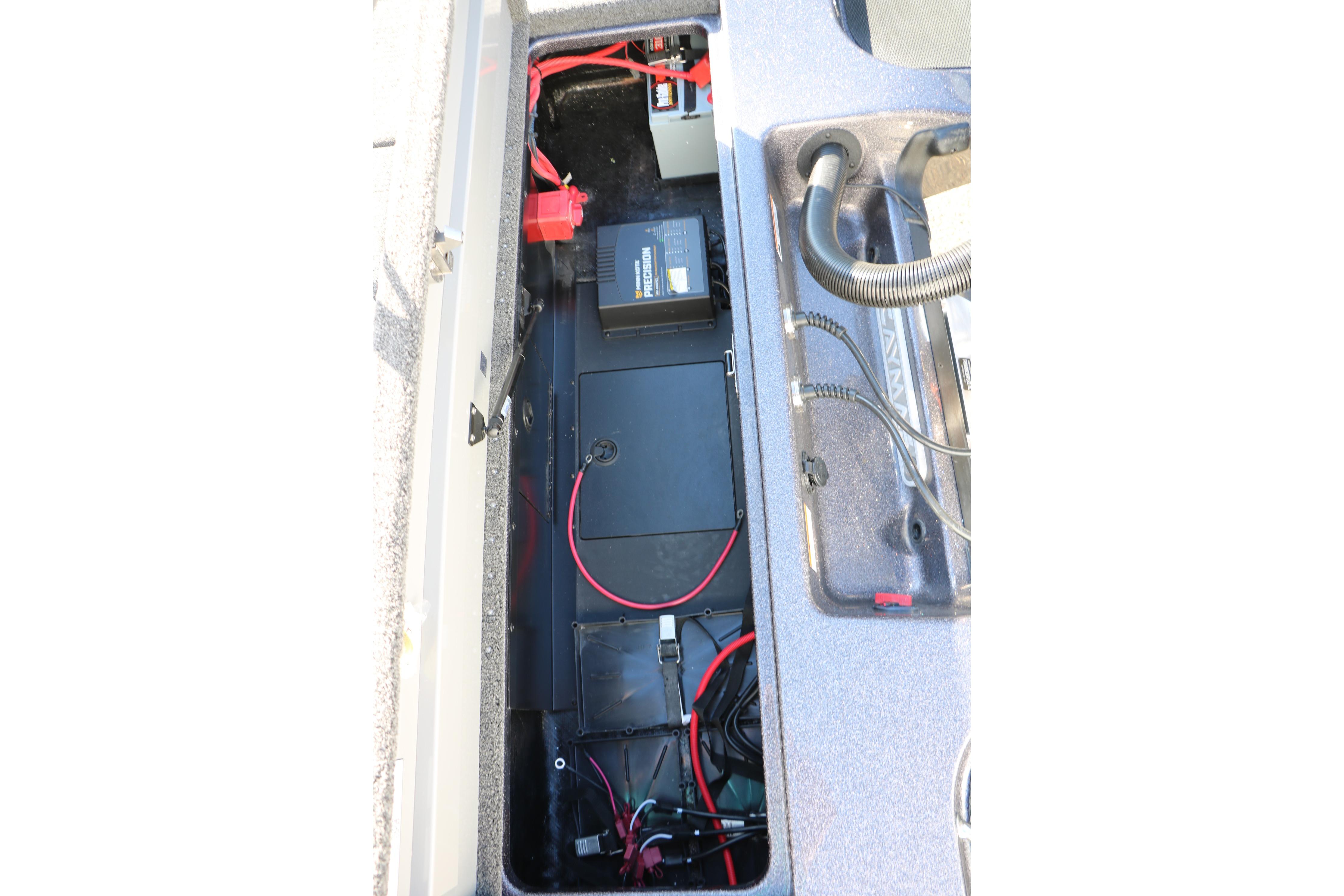 2027 Caymas 201 Pro boat battery compartment with wiring and components.