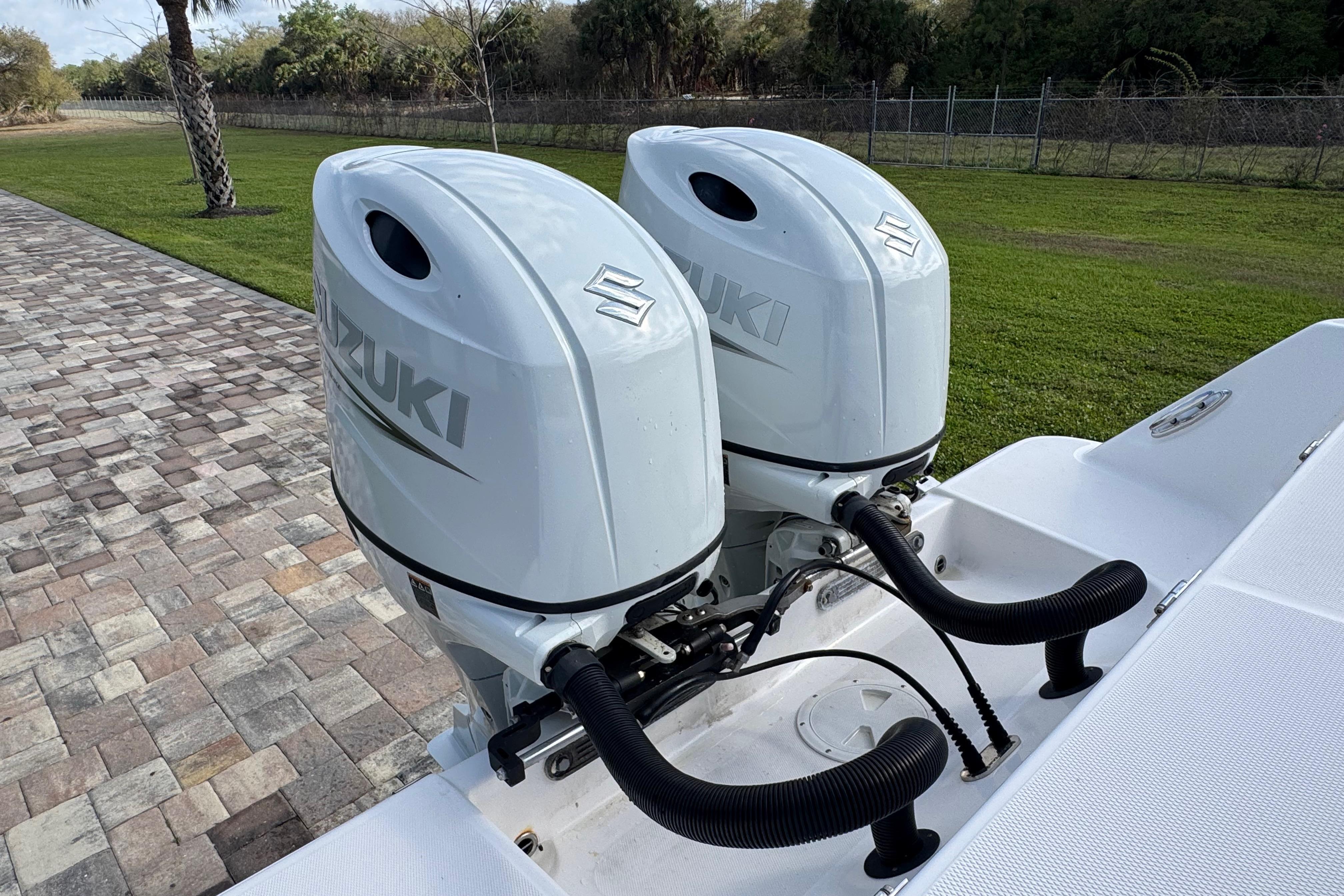Twin Suzuki outboard engines on 2022 Aquasport 2500 Center Console boat.