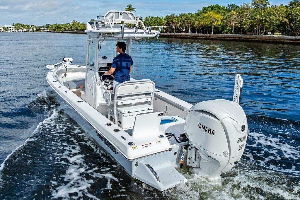 2023 Everglades 243 Center Console boat cruising on water with Yamaha engine.