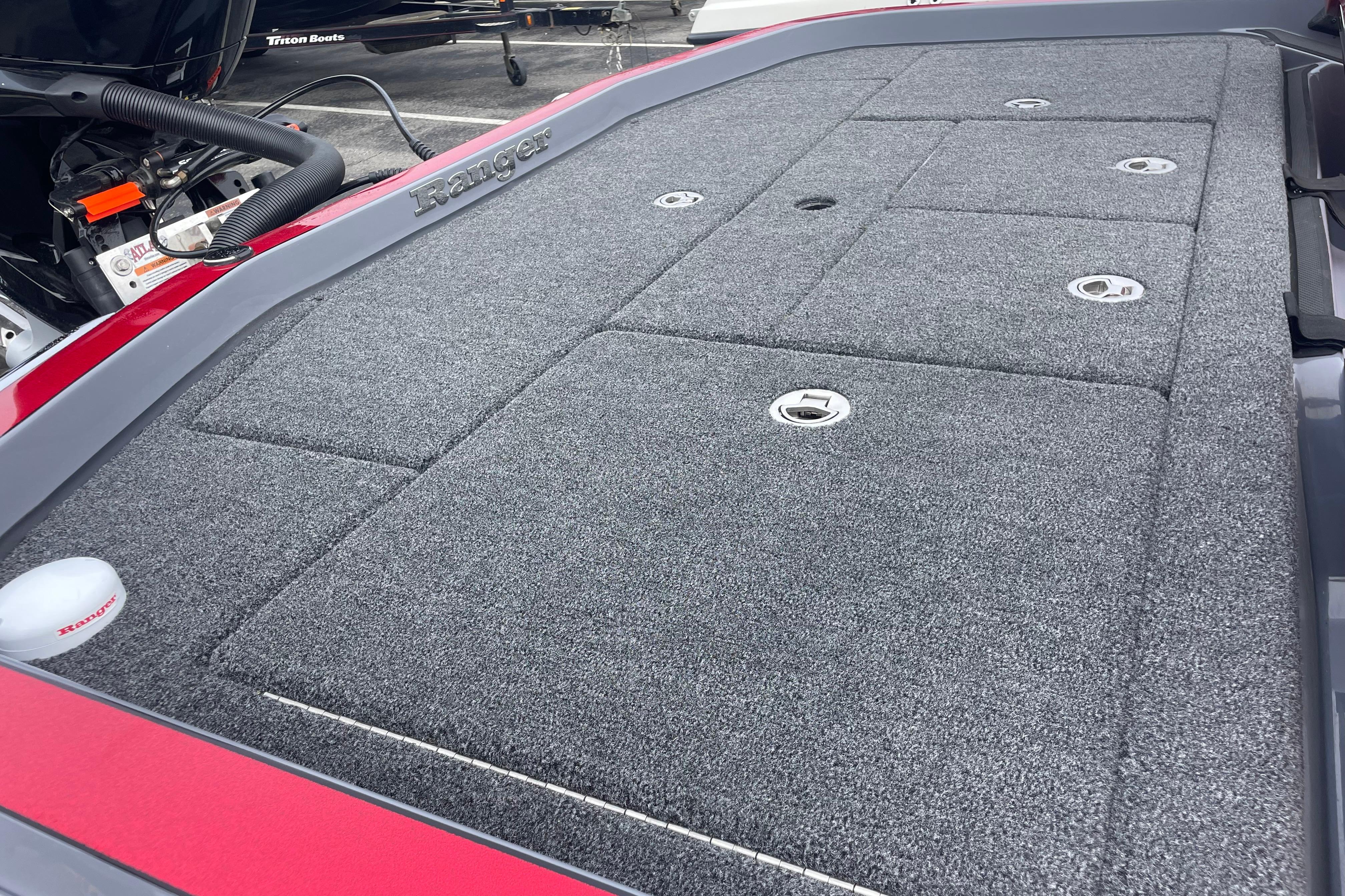 2025 Ranger Z520R Cup-Equipped boat deck with carpeted storage compartments.