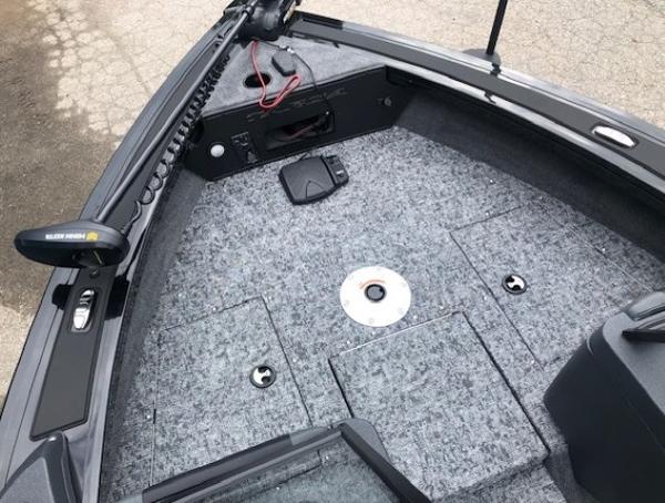 2025 Tracker Targa V18 Combo boat deck with storage compartments and trolling motor.