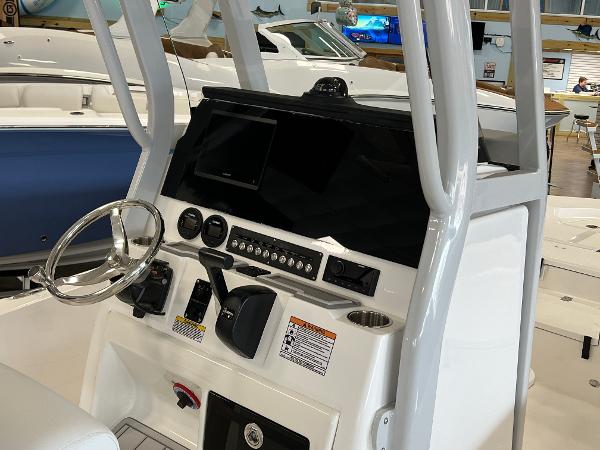 2024 Sea Fox 231 Bay boat console with steering wheel and control panel.