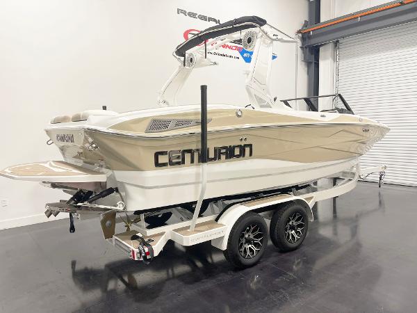 2025 Centurion NV213 boat on trailer in showroom.