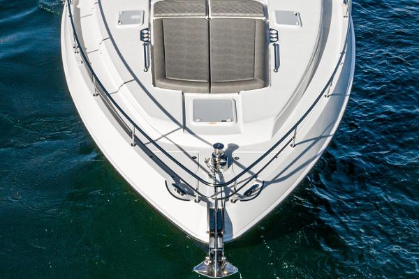 2021 Riviera 5400 Sport Yacht bow view on water.