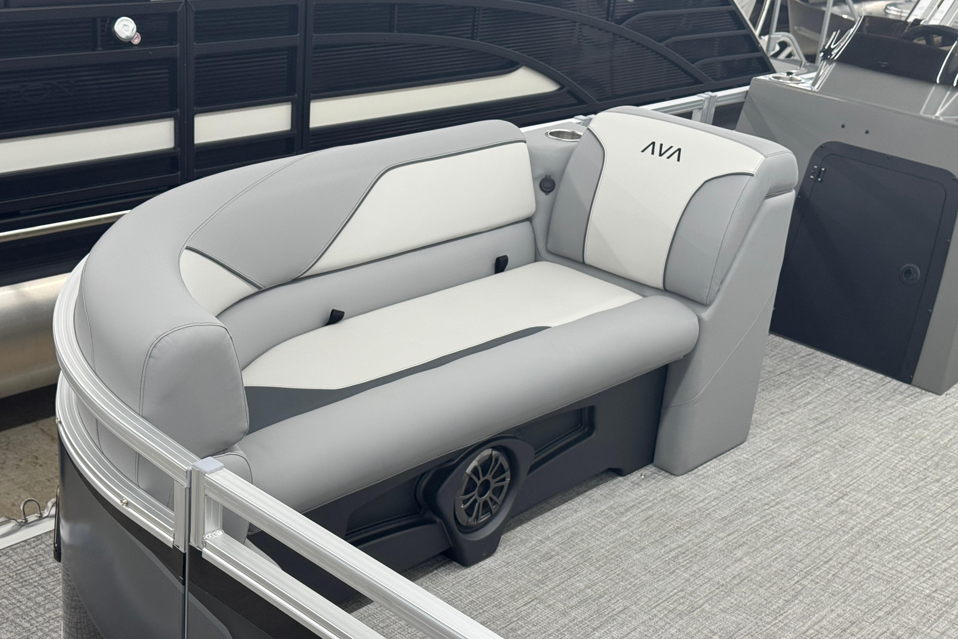 Luxurious seating on 2026 Avalon Ventue 85 RF pontoon boat, featuring sleek gray and white upholstery.