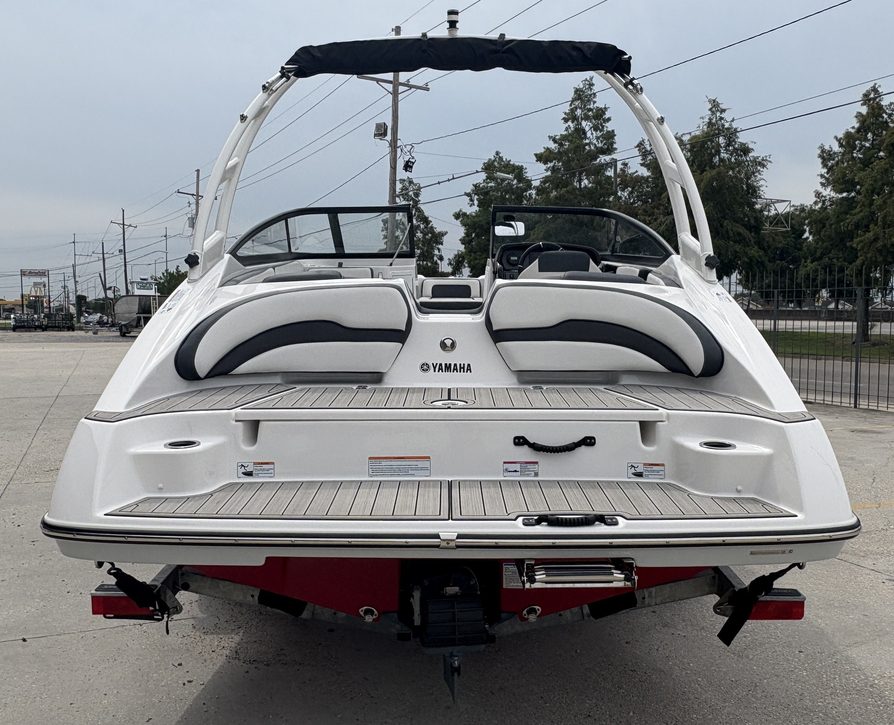 2024 Yamaha Boats AR 195, rear view, showcasing sleek design and spacious seating.