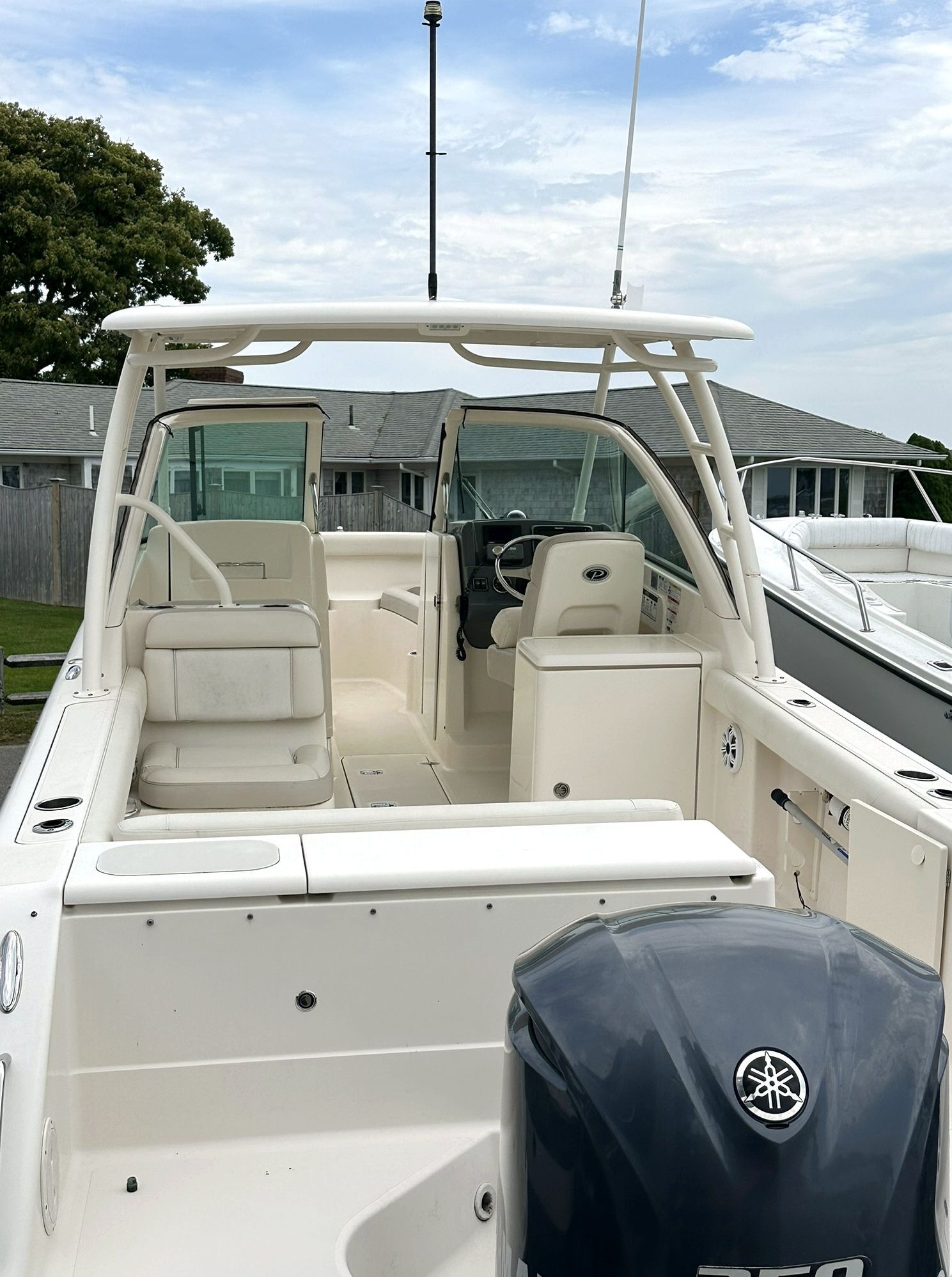 2012 Pursuit DC 265 Dual Console boat in harbor.
