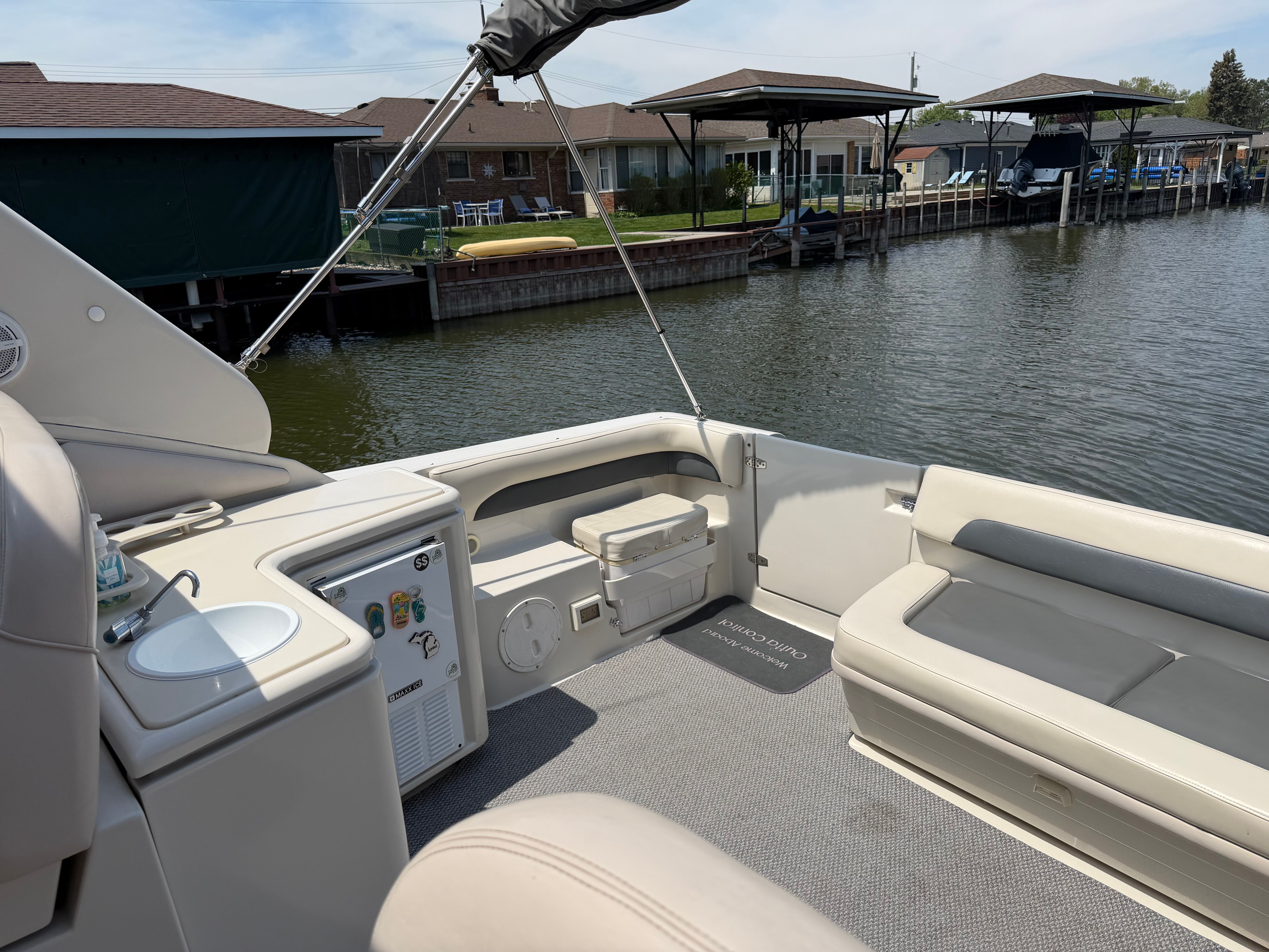 Interior of a 1997 Regal Commodore boat by the water.