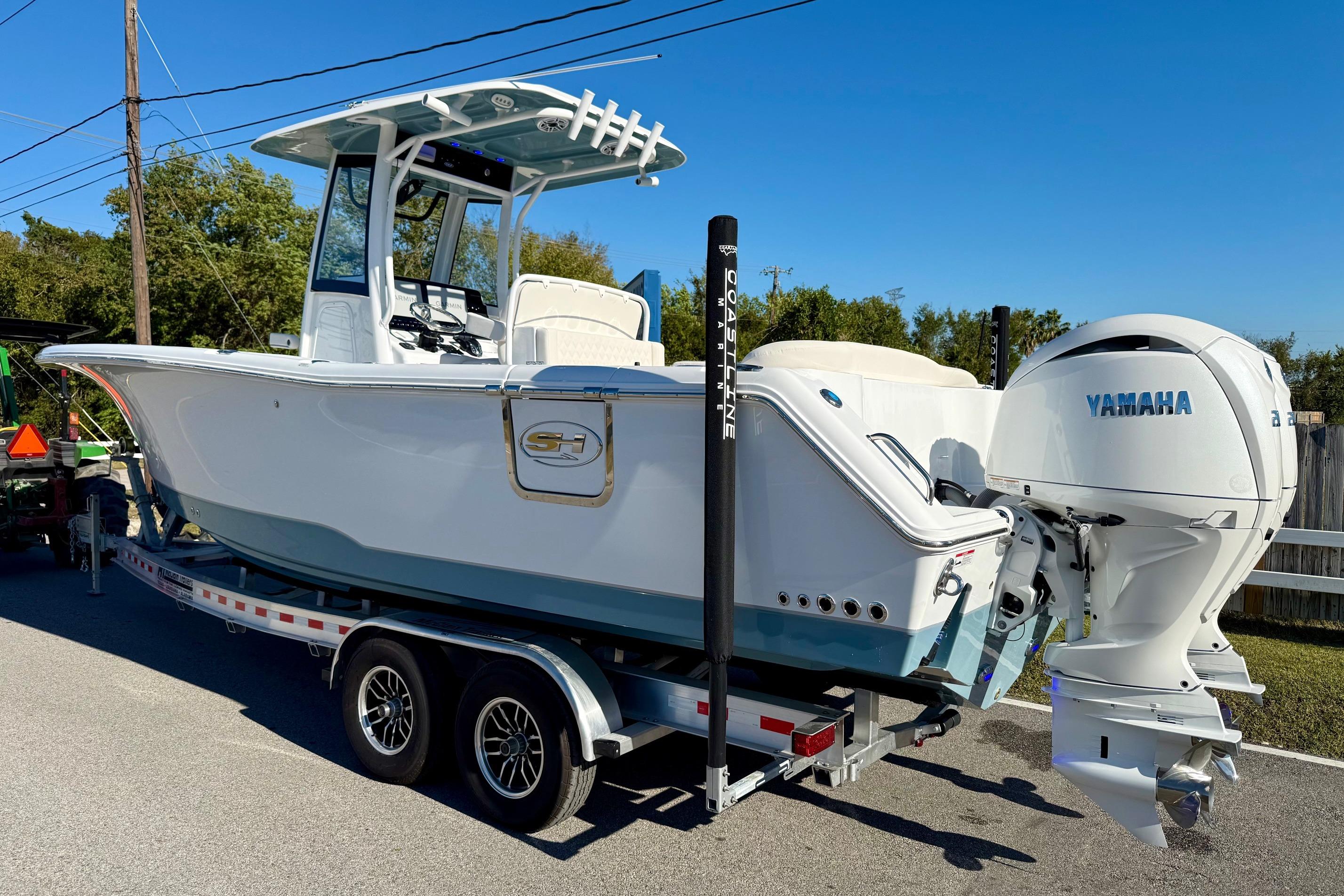 2026 Sea Hunt Ultra 275 Coffin Box boat on trailer with Yamaha engine.