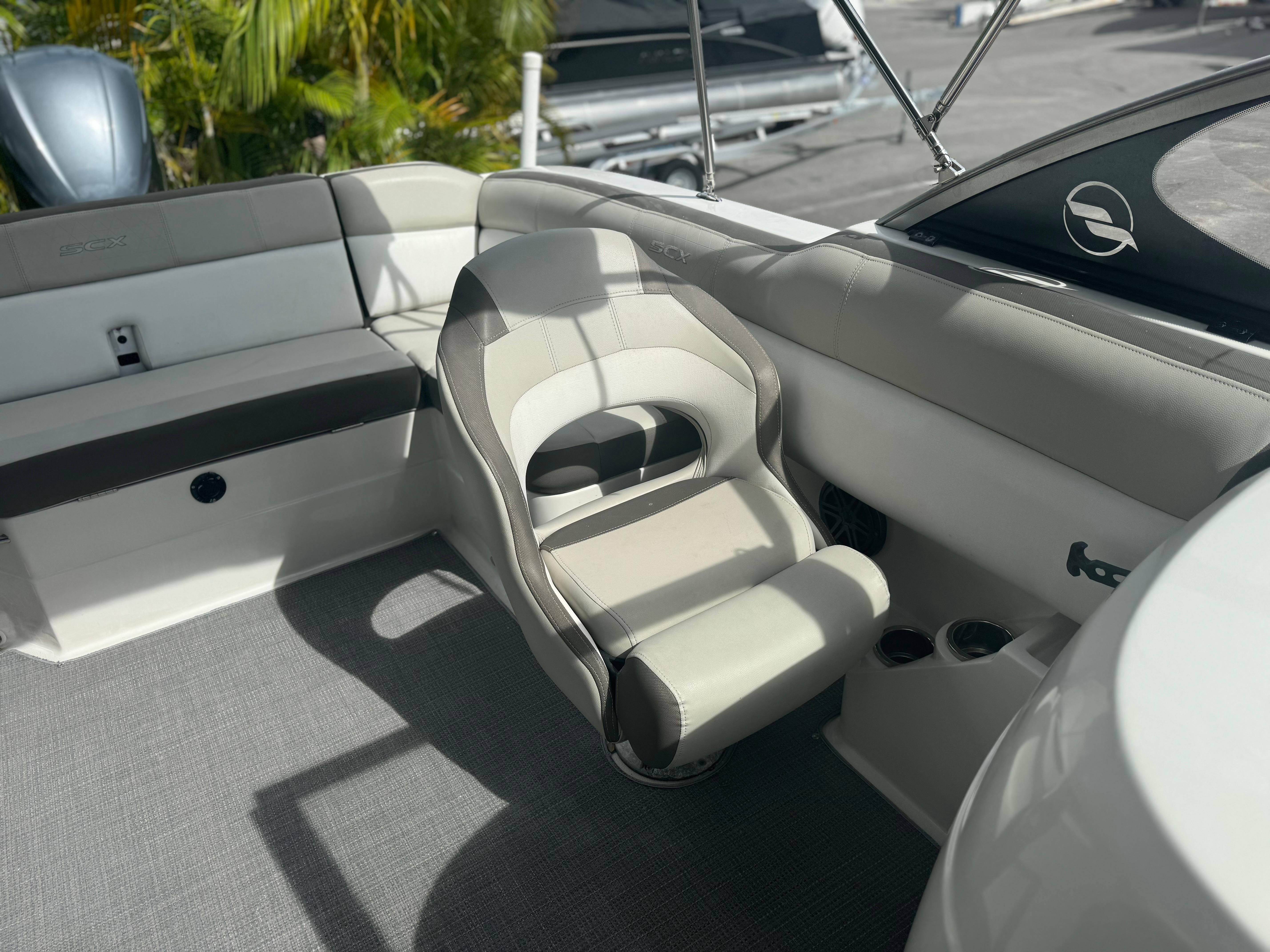 2017 Starcraft 230 OB SCX EXT boat interior with seating and cup holders.