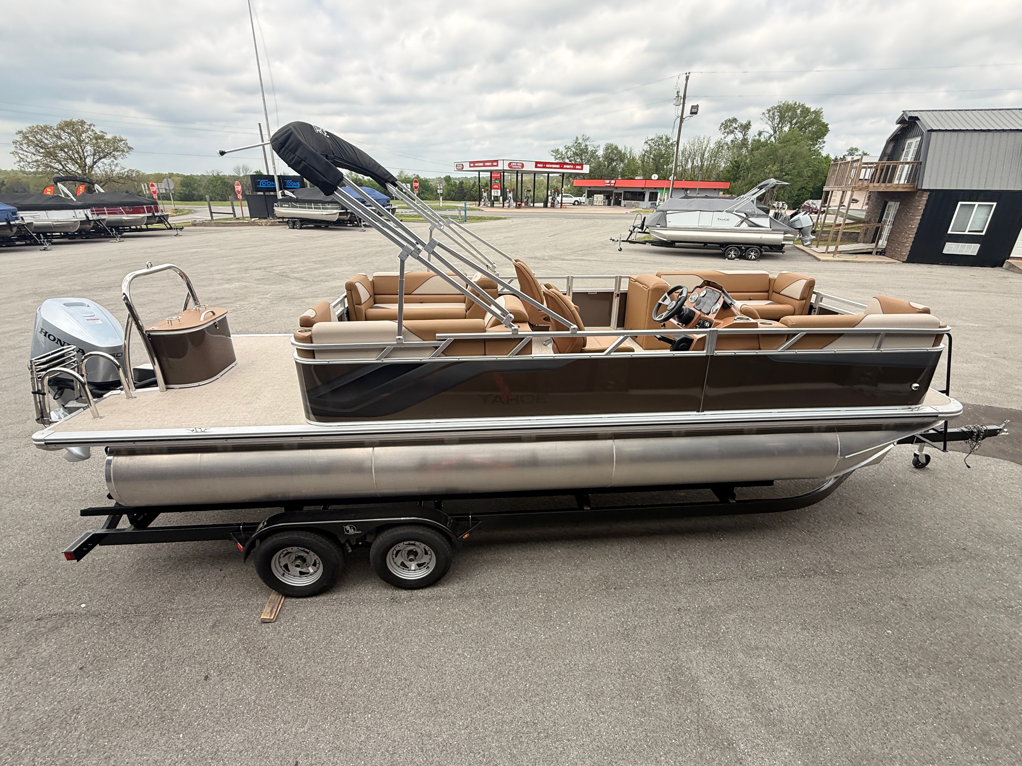 2026 Tahoe 2380 Sport Quad Lounger pontoon boat on trailer.
