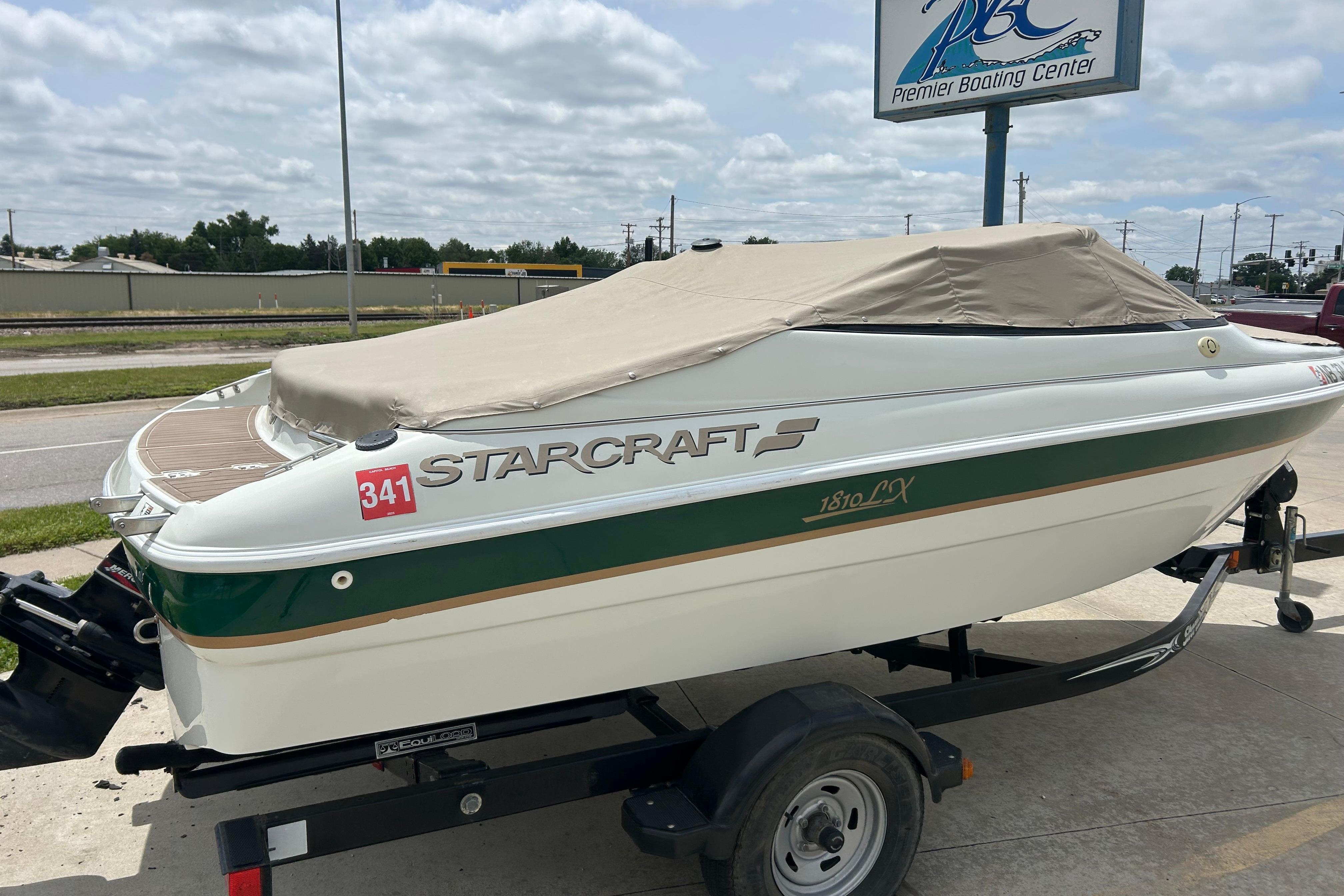 2000 Starcraft 1810 boat on trailer, covered, at Premier Boating Center.