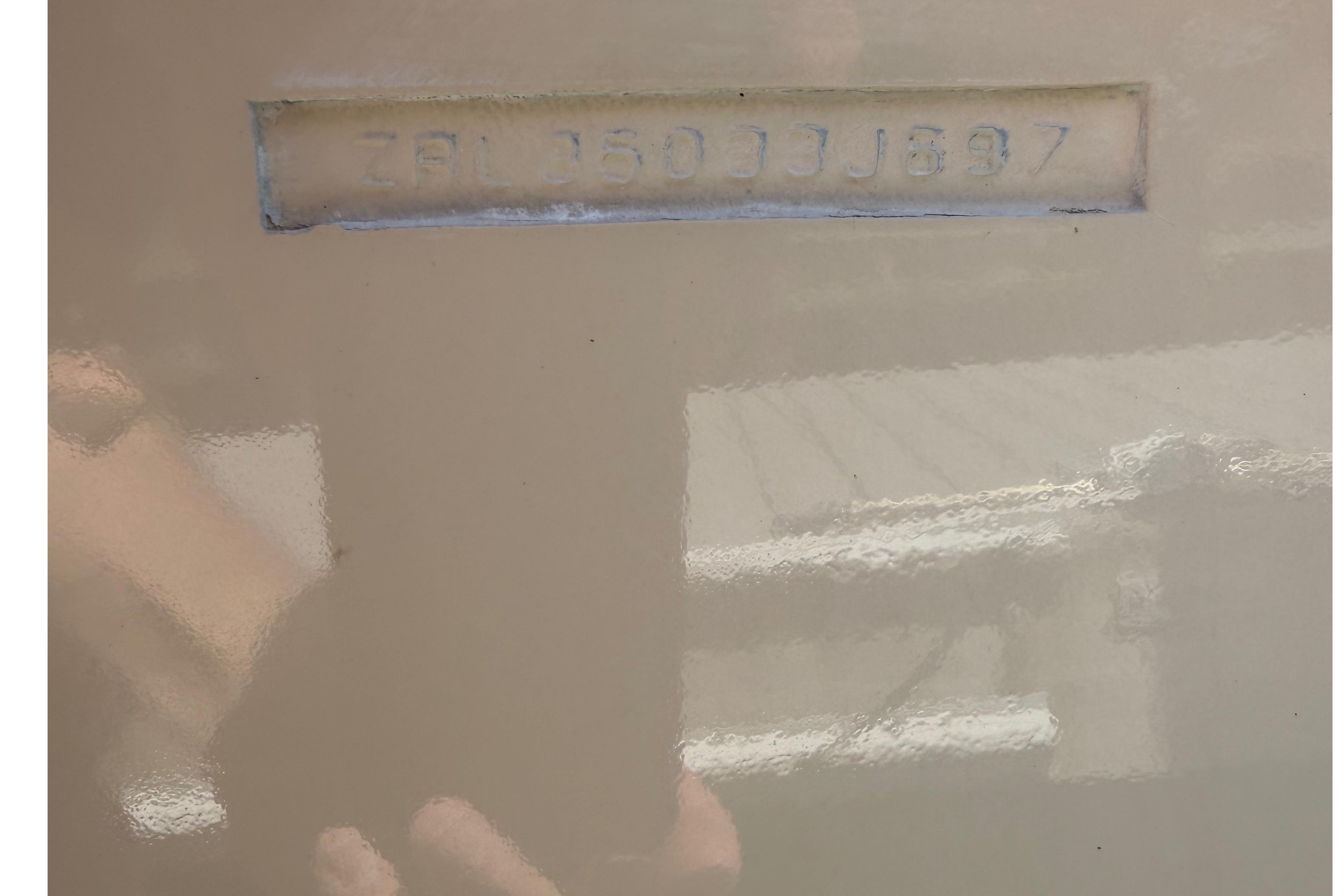 1997 Rosborough Trawler hull identification number embossed on beige surface.