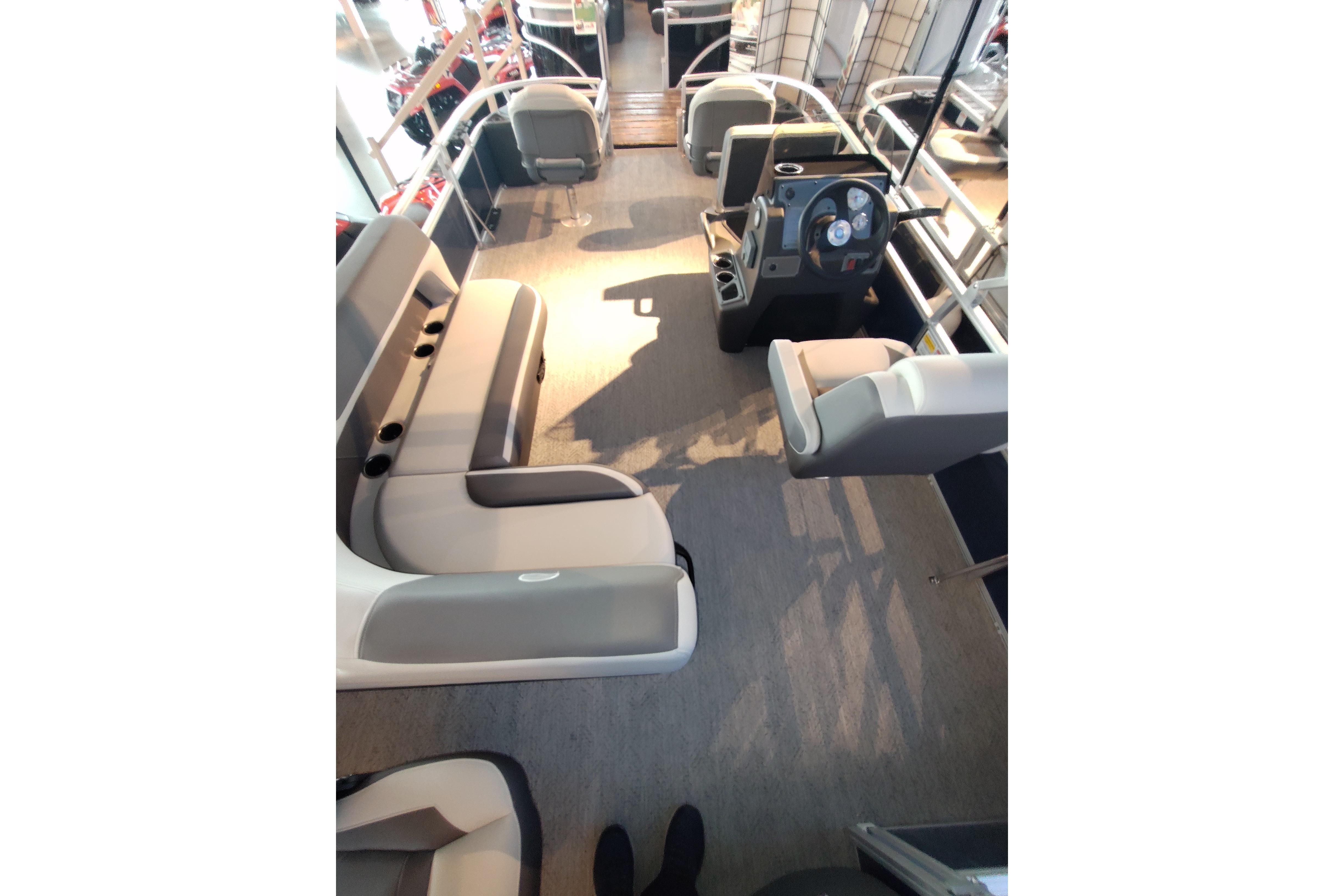2026 Sun Tracker Bass Buggy 18 DLX interior with spacious seating and modern helm.