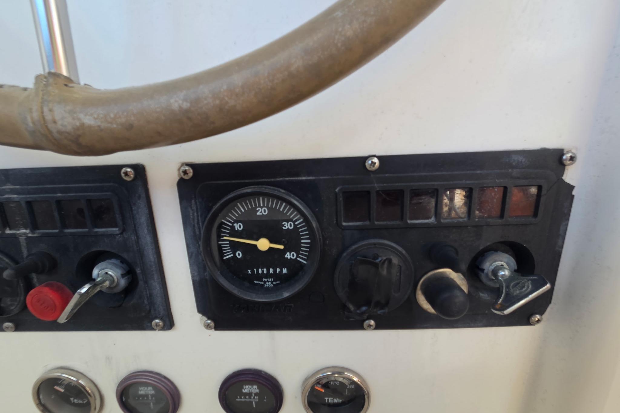 Control panel of a 2000 Fountaine Pajot Maryland 37 boat with gauges and switches.