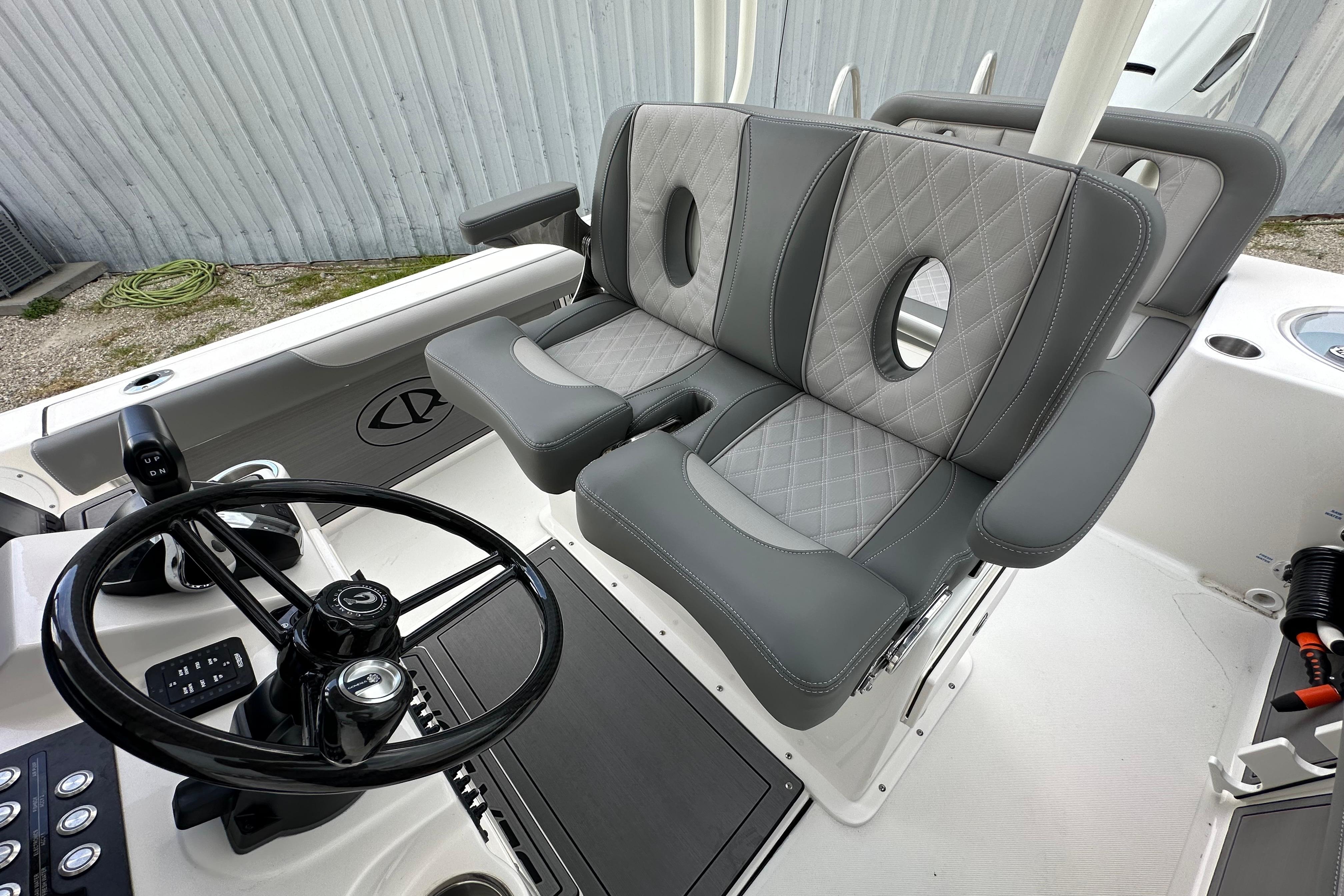 2027 Sea Born LX24 Center Console boat interior with dual gray seats and steering wheel.