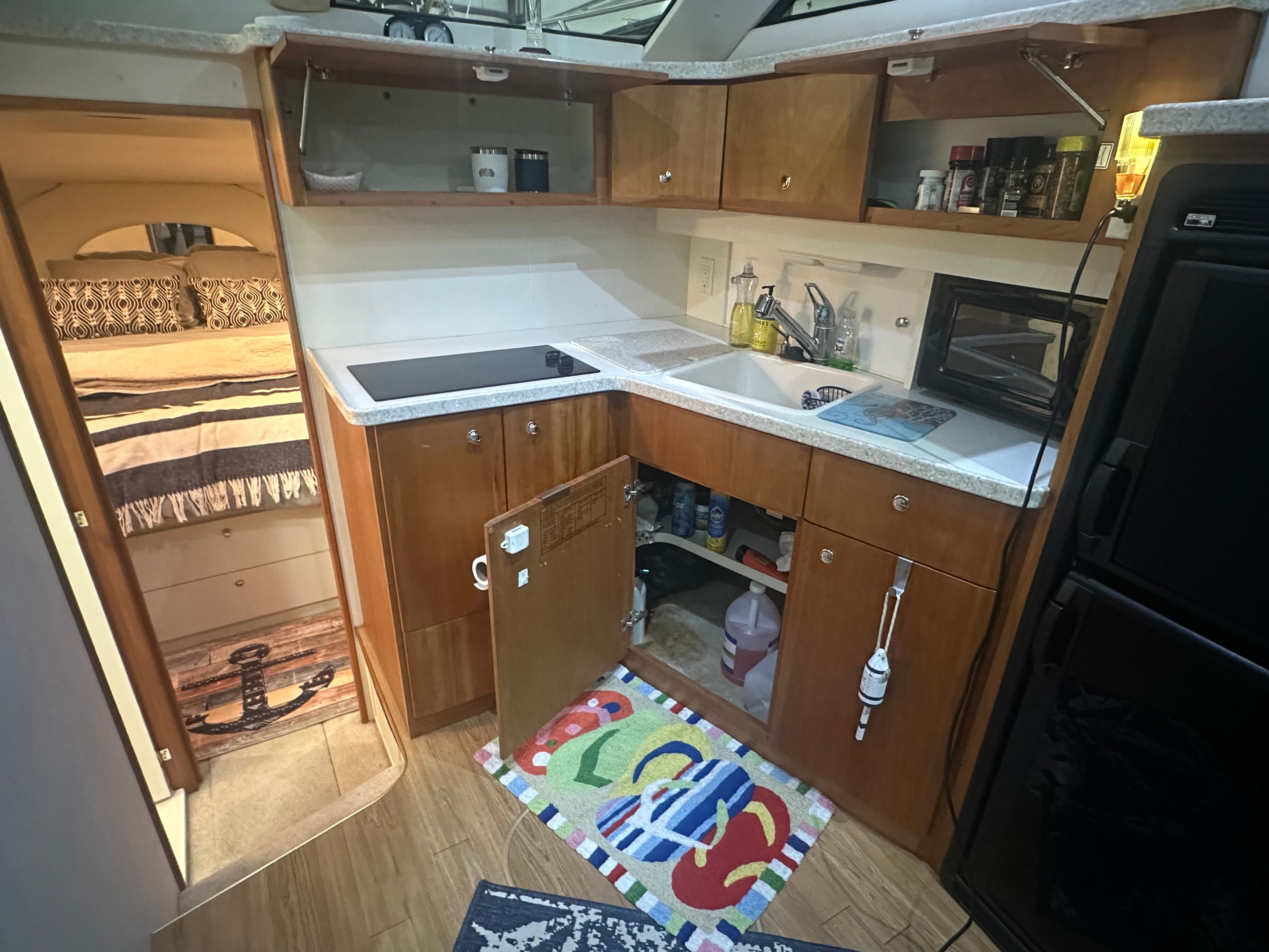 Interior of 2000 Silverton 351 Sedan with kitchen and sleeping area.