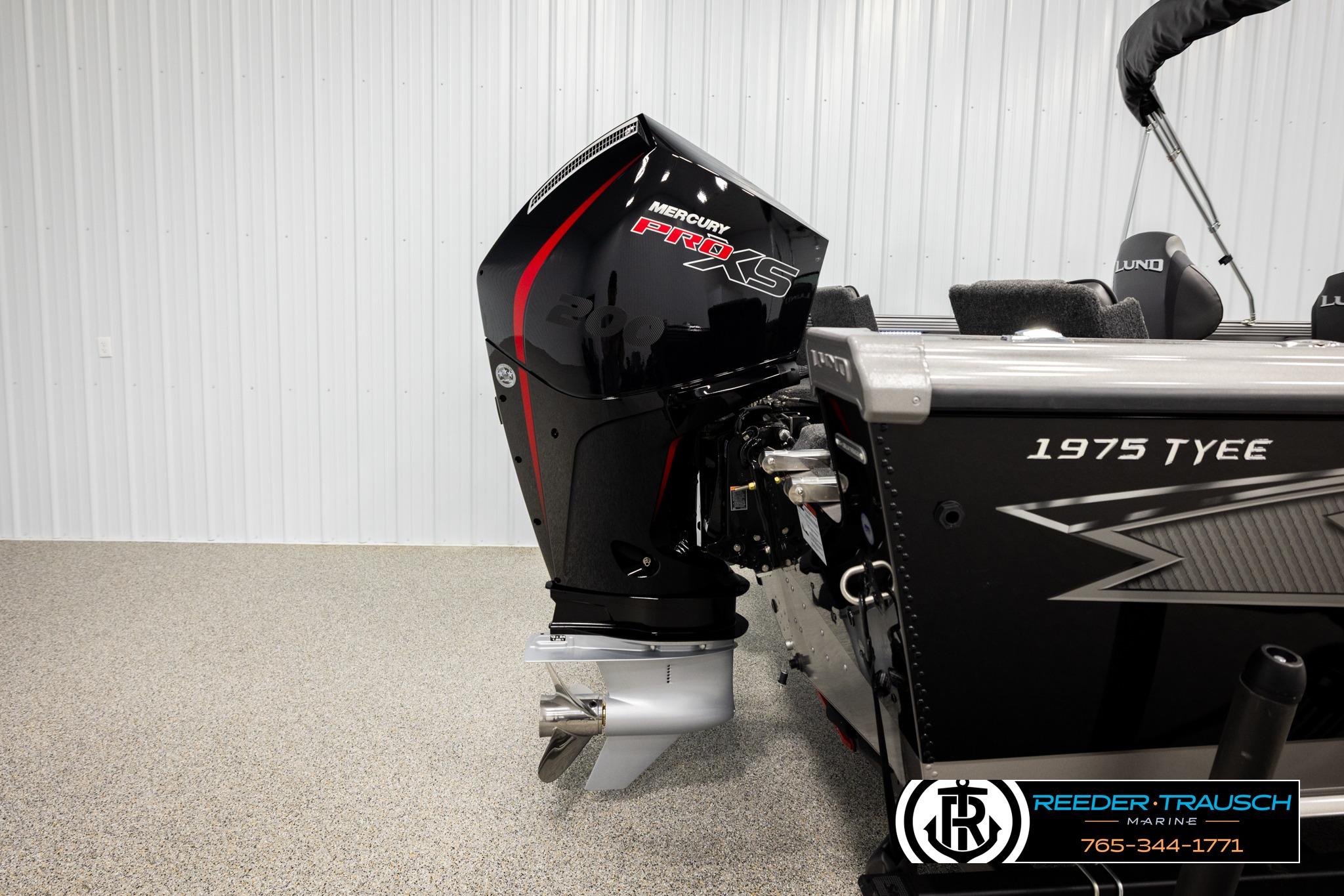 2026 Lund 1975 Tyee boat with Mercury Pro XS engine in showroom.