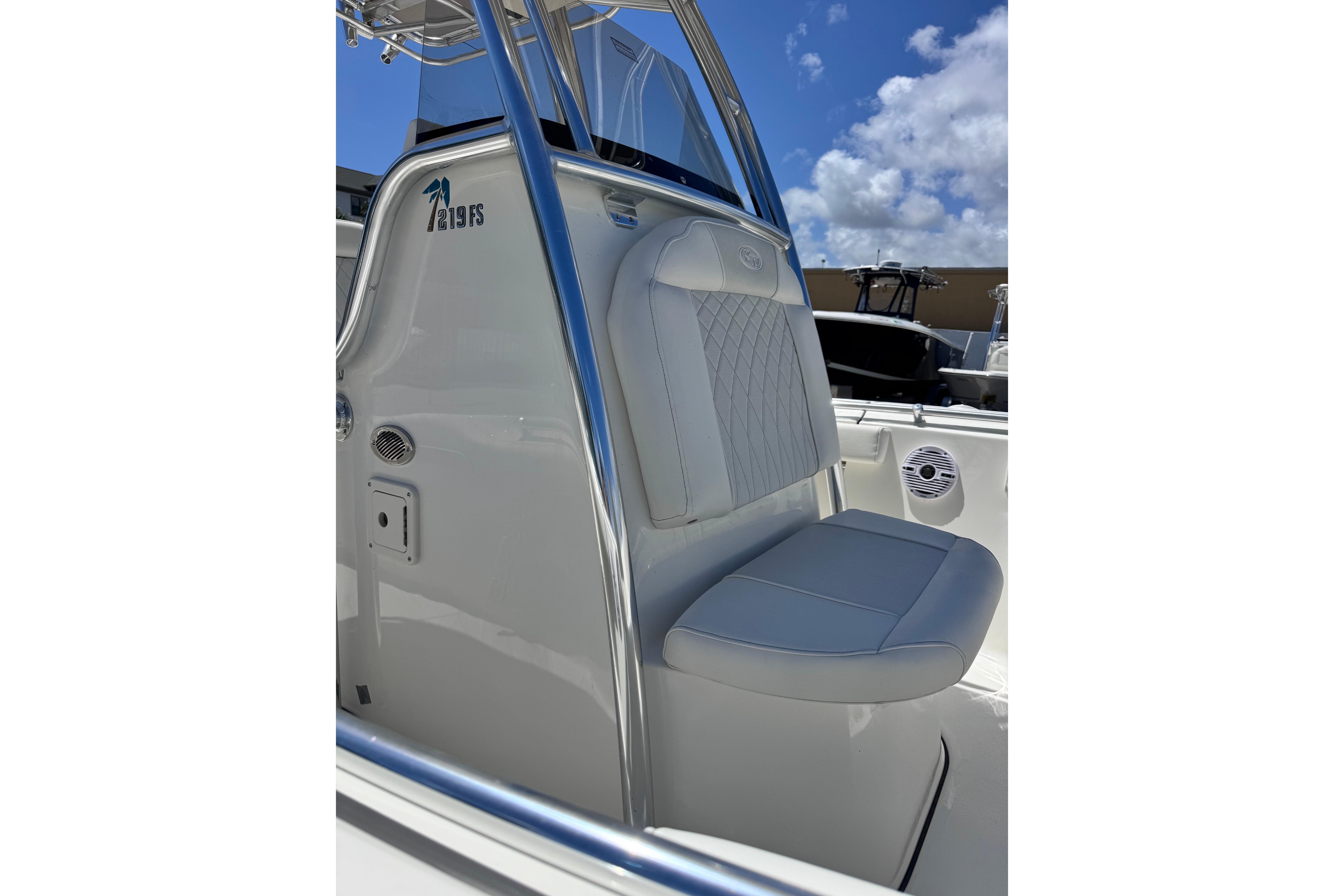2026 Key West 219 FS boat interior with cushioned seating and sleek design.