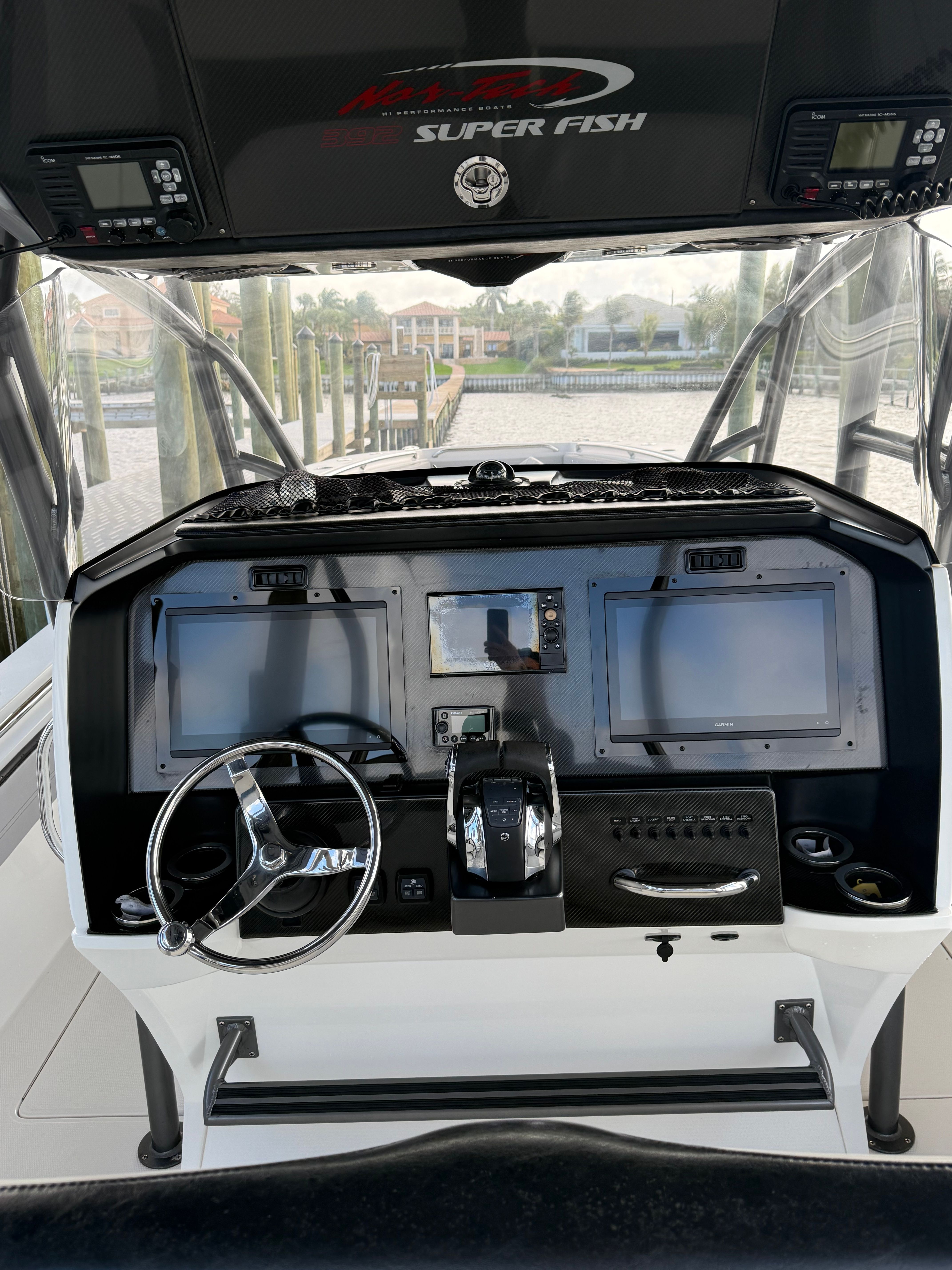 2018 Nor-Tech 392 Super Fish cockpit with modern electronics.