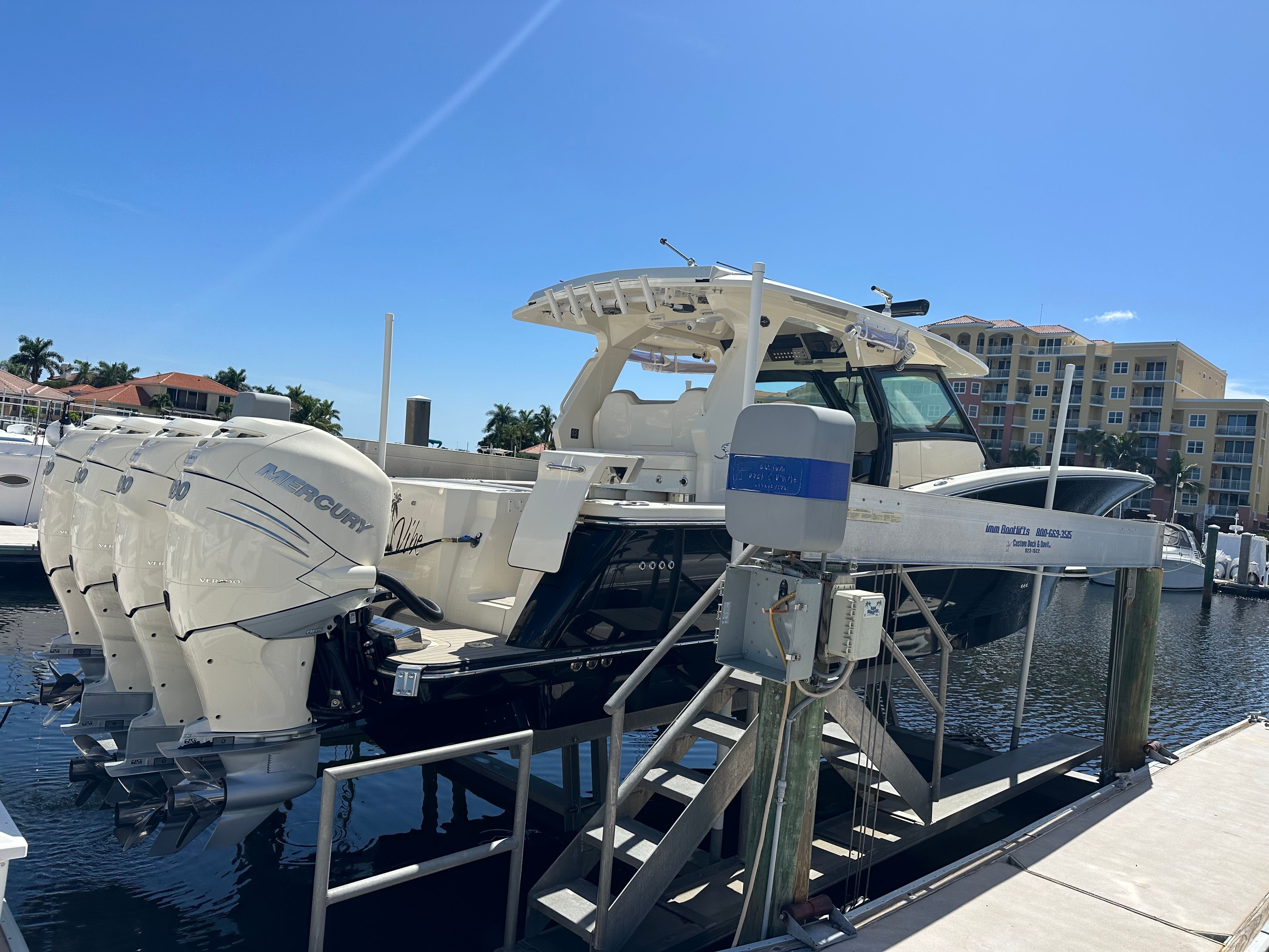 Scout 425 LXF 2022 on boat lift at marina.